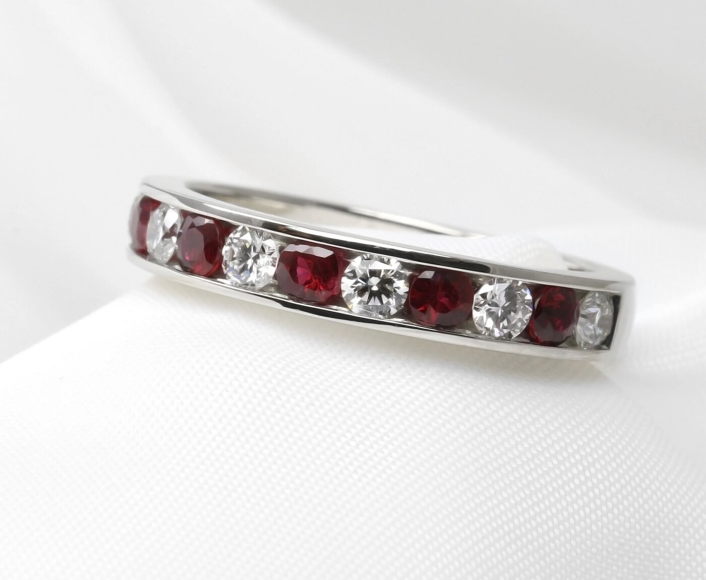 Channel Set Ruby and Diamond Half Eternity Ring