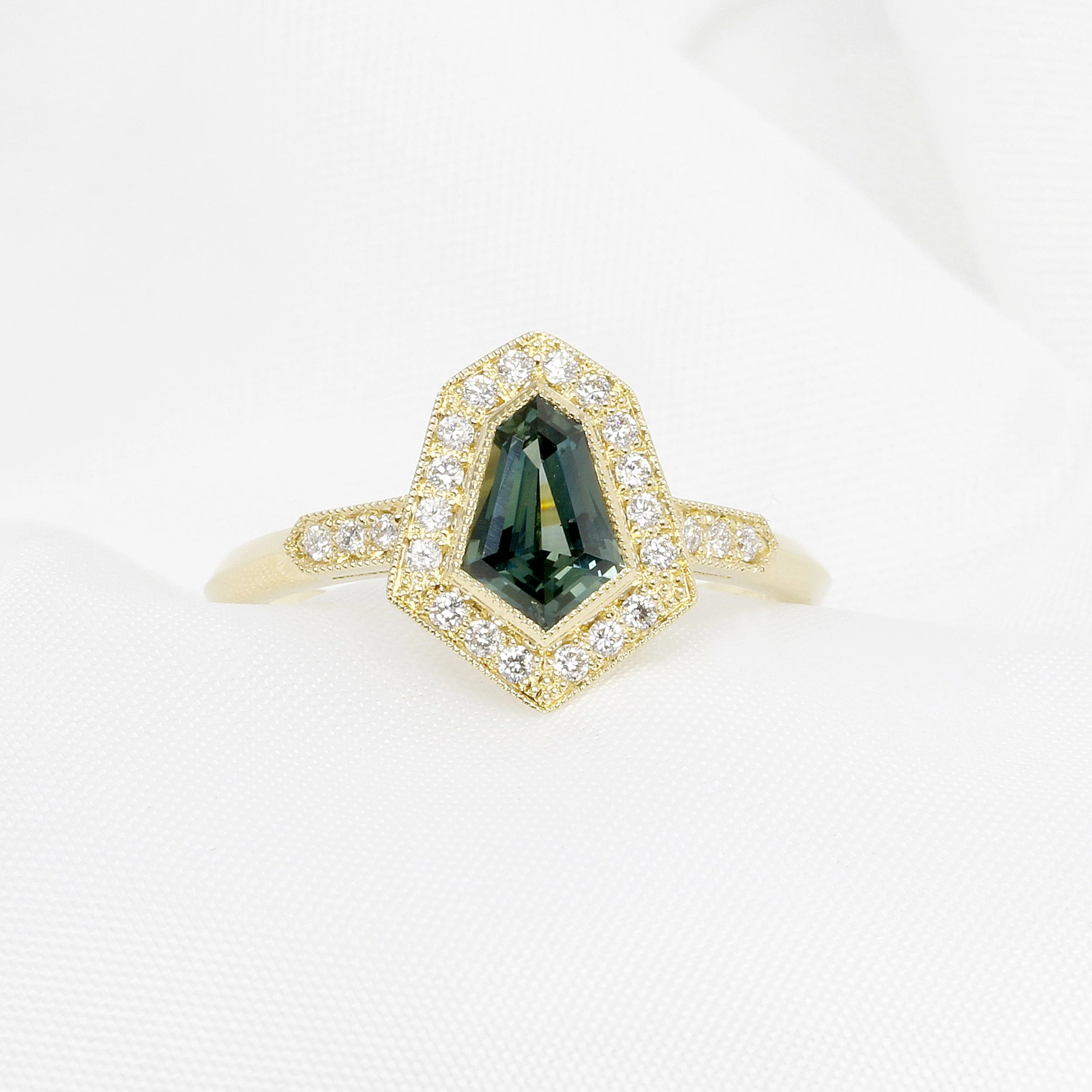 Green Sapphire and Diamond Halo Ring in 18ct Yellow Gold