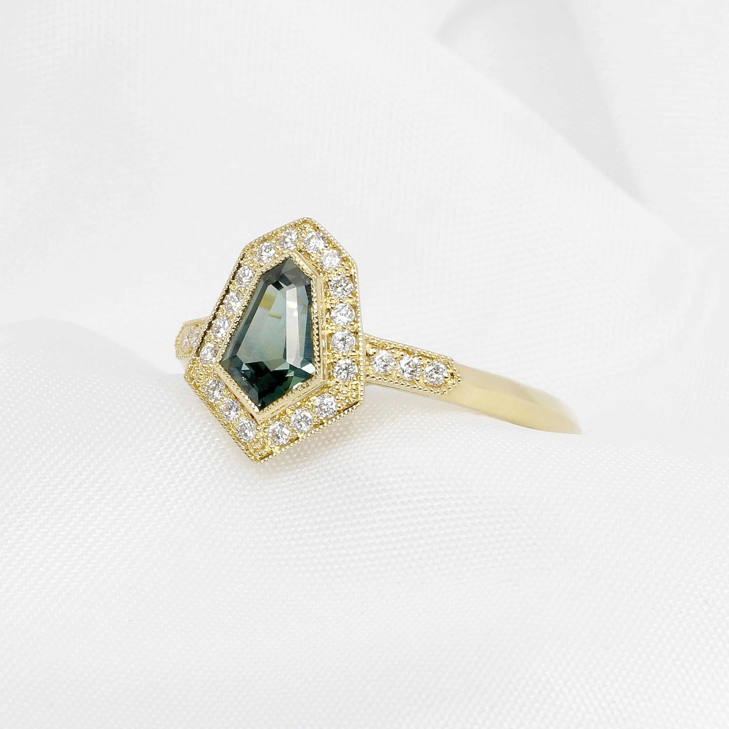 Green Sapphire and Diamond Halo Ring in 18ct Yellow Gold