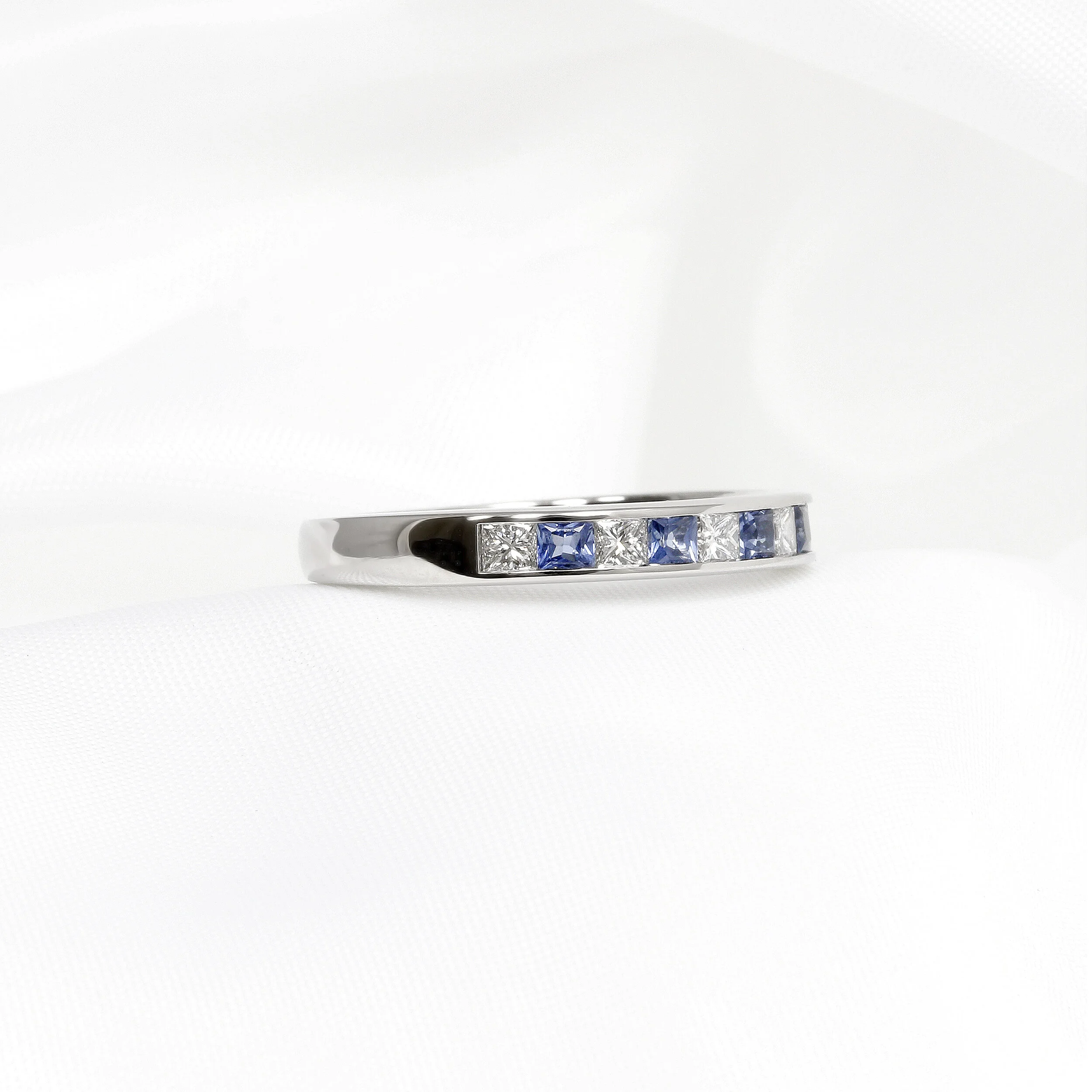 Blue Sapphire and Diamond Half Eternity Ring in Platinum