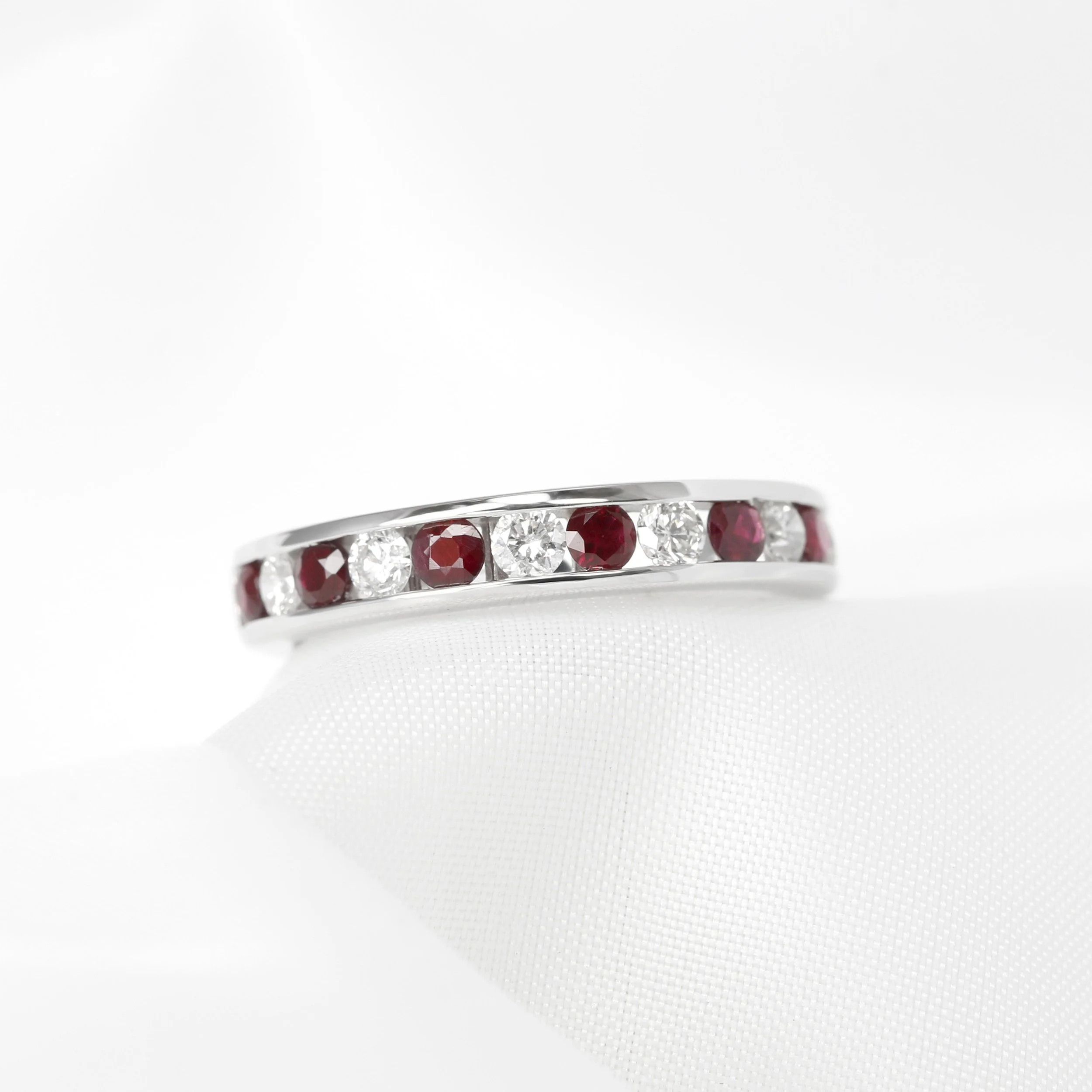 Channel Set Ruby and Diamond Half Eternity Ring