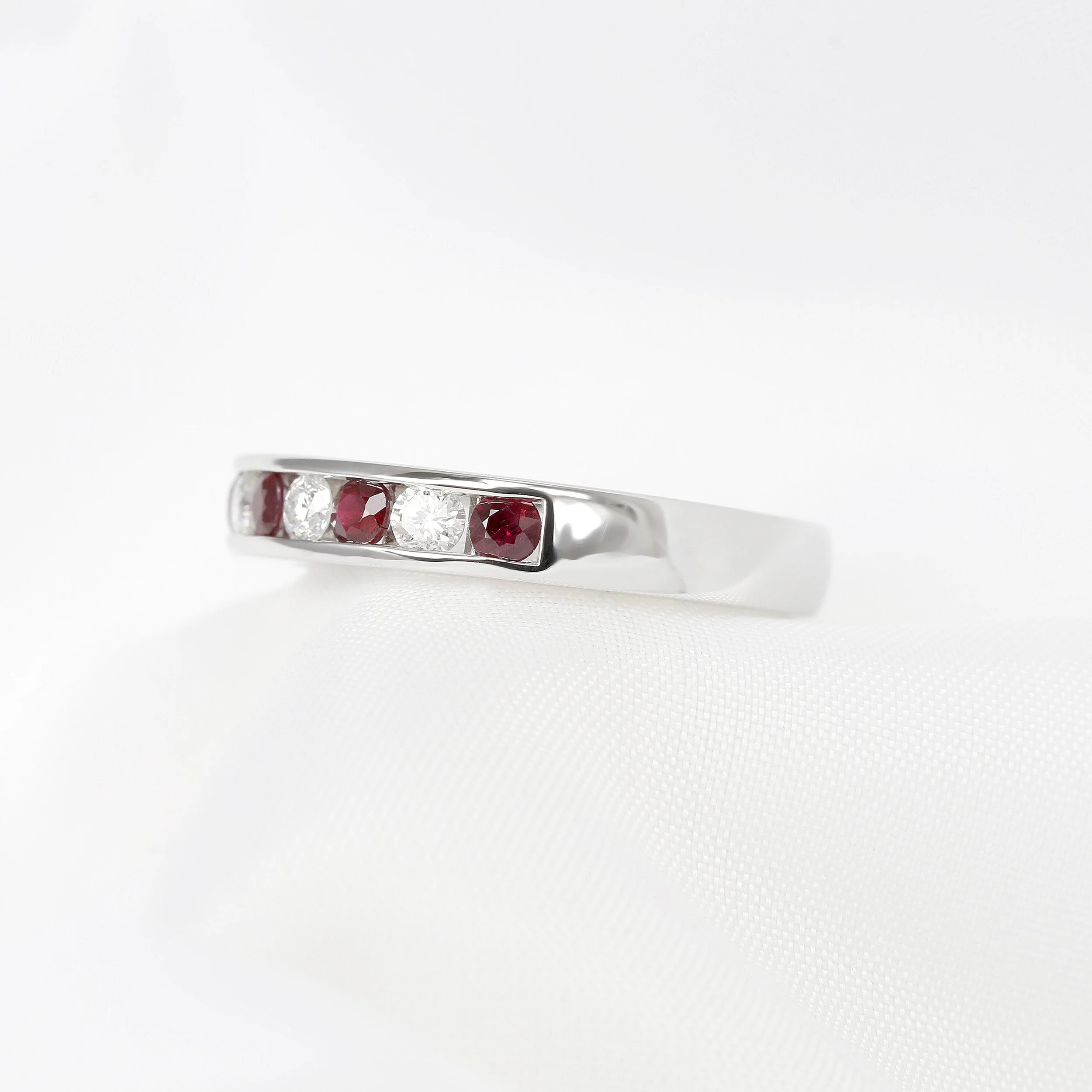 Channel Set Ruby and Diamond Half Eternity Ring
