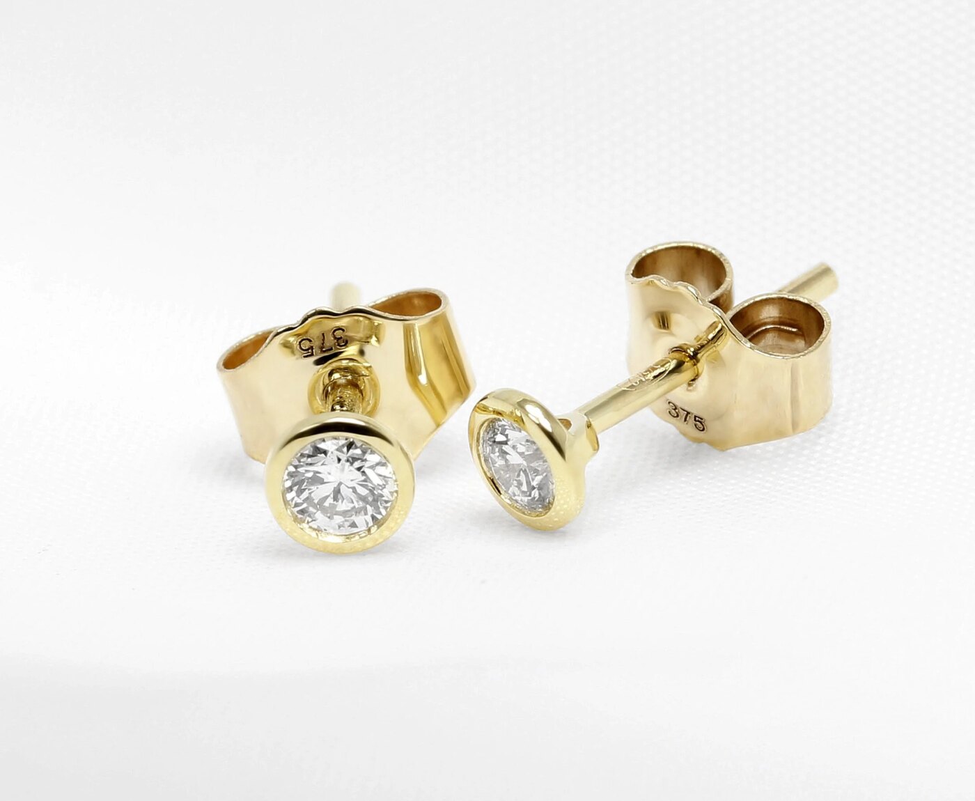 0.20ct Rub Over Set Yellow Gold Diamond Studs