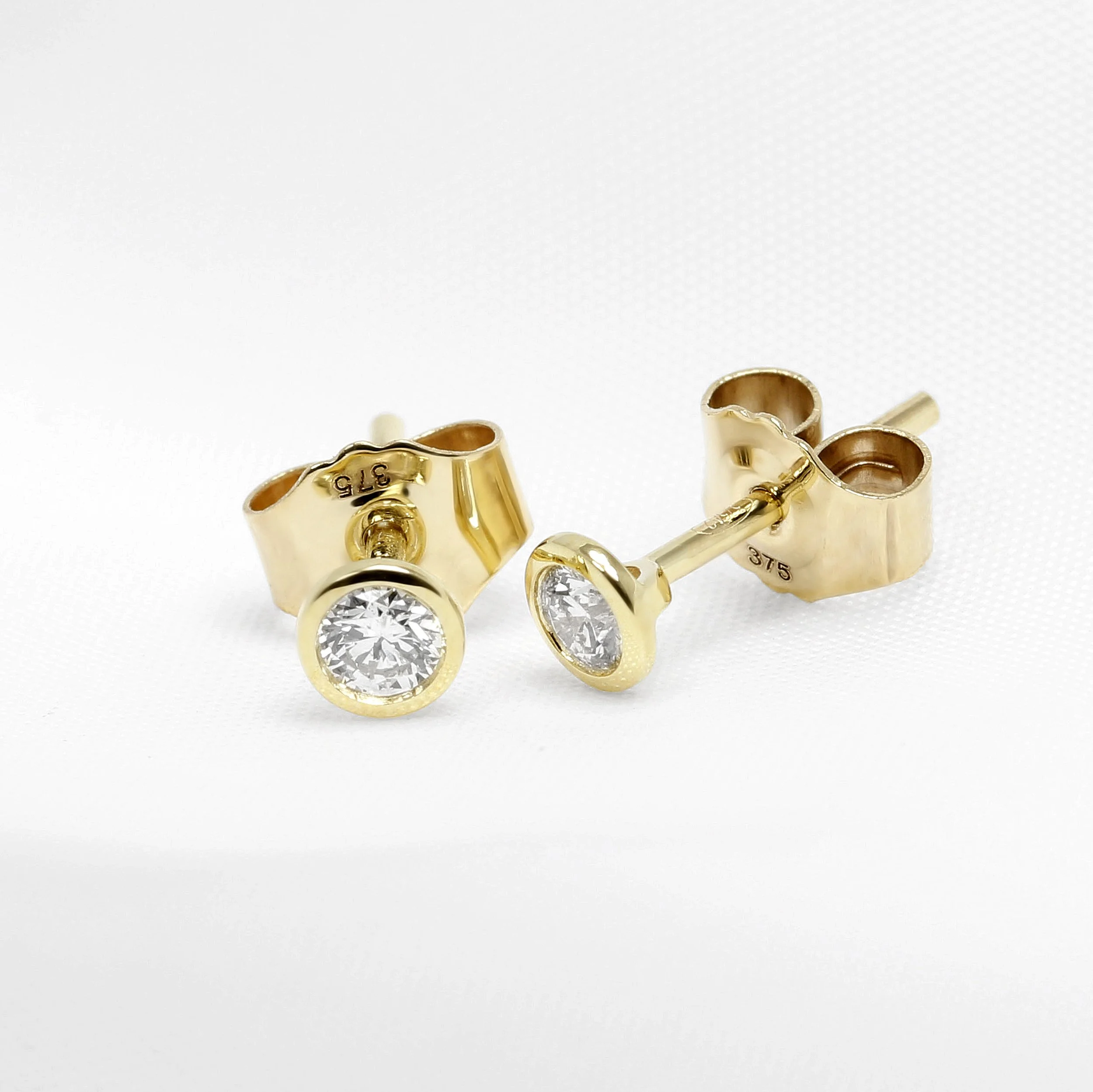 0.20ct Rub Over Set Yellow Gold Diamond Studs