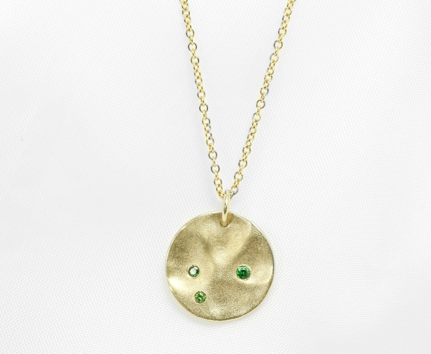 Molten Disc Pendant with Tsavorite Garnets in Yellow Gold