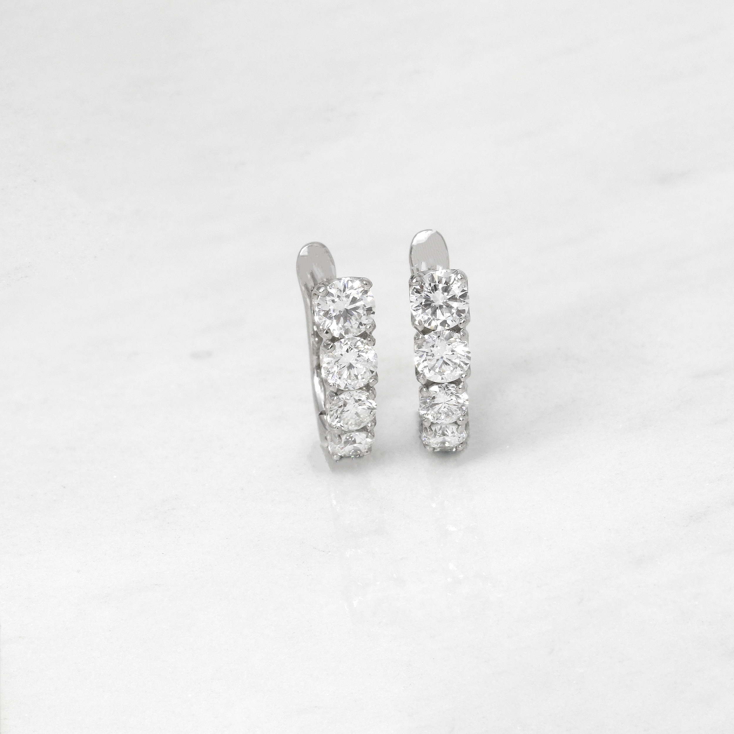 White Gold Graduating Diamond Hoop Earrings