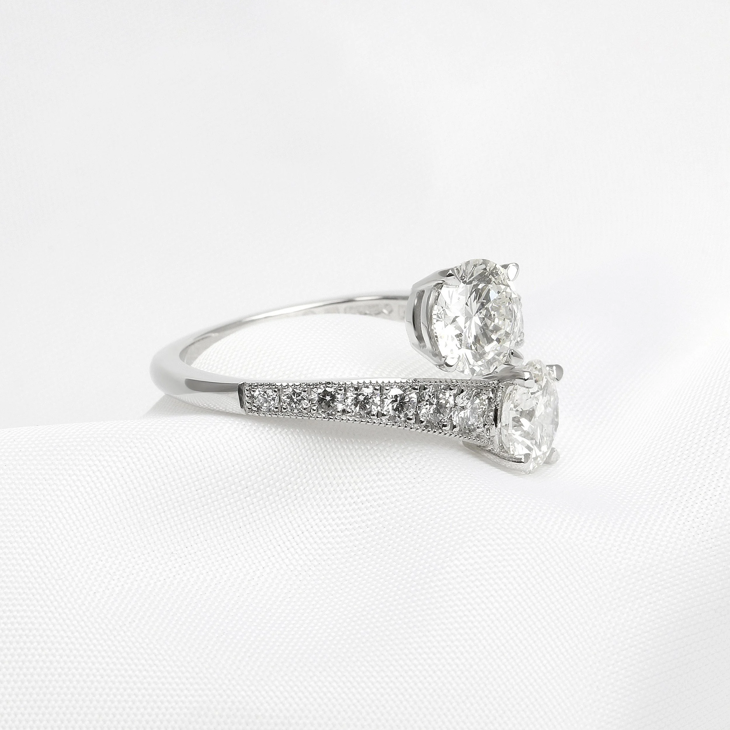Two Diamond Cross Over Ring in Platinum