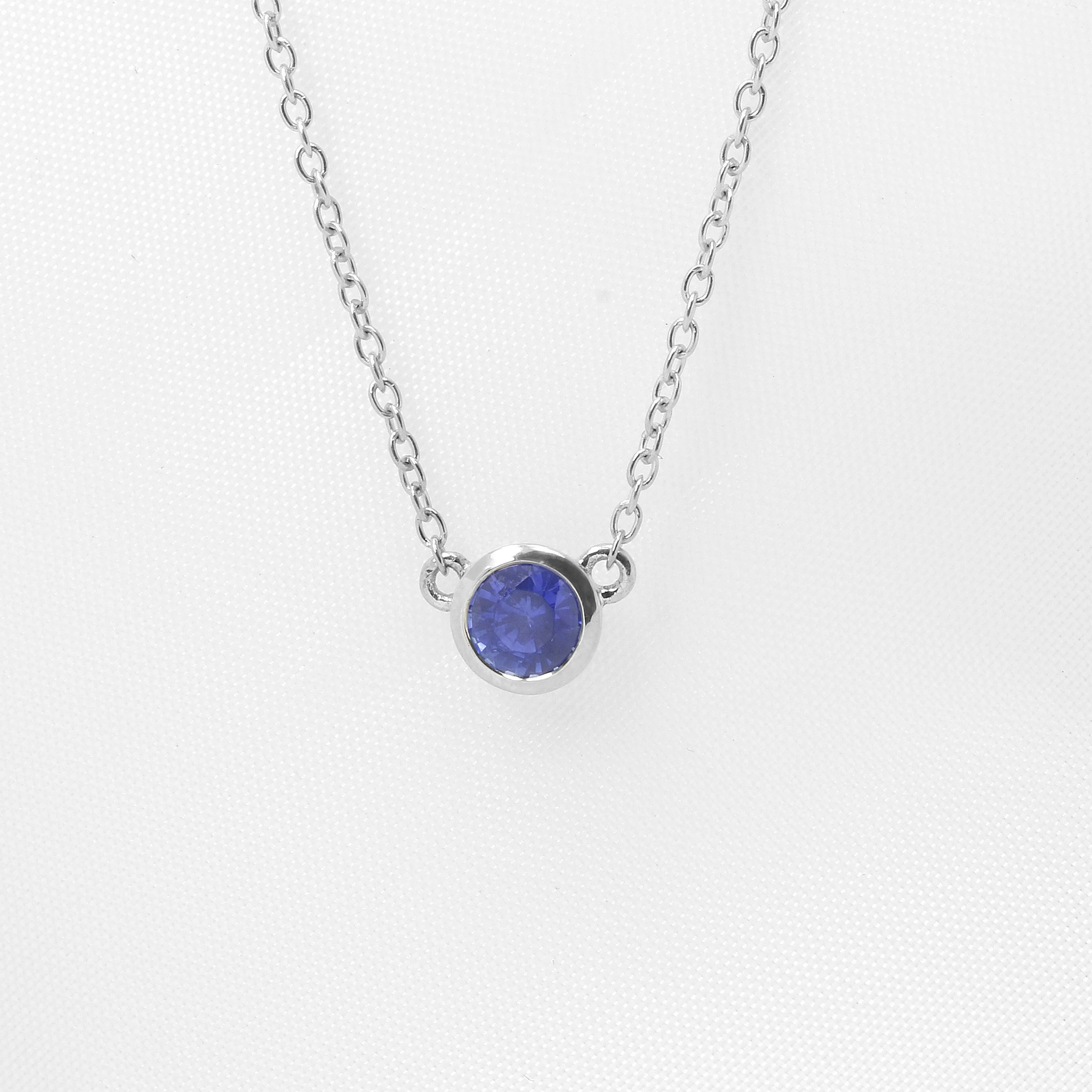 Round Sapphire Necklace in White Gold
