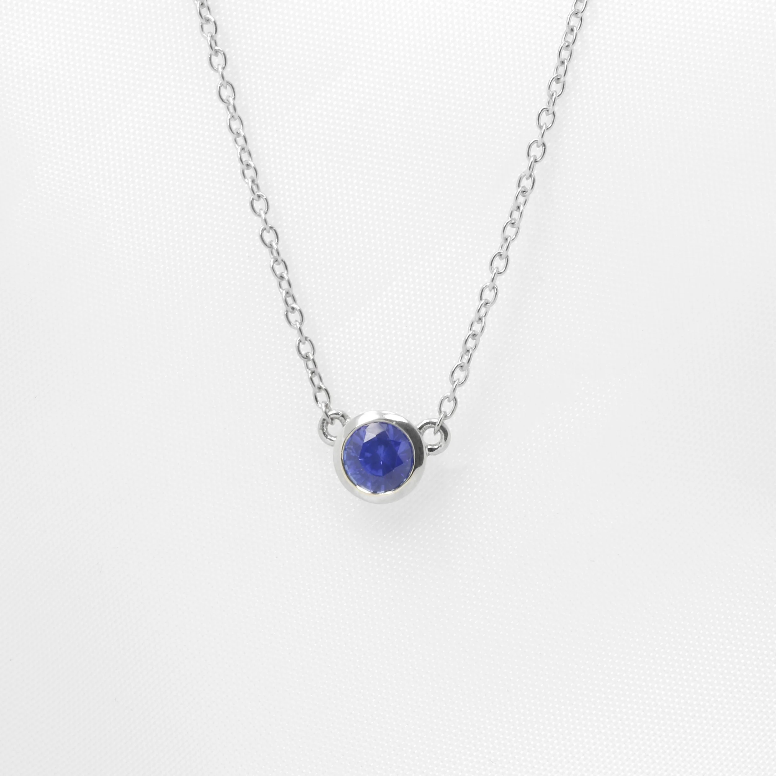 Round Sapphire Necklace in White Gold