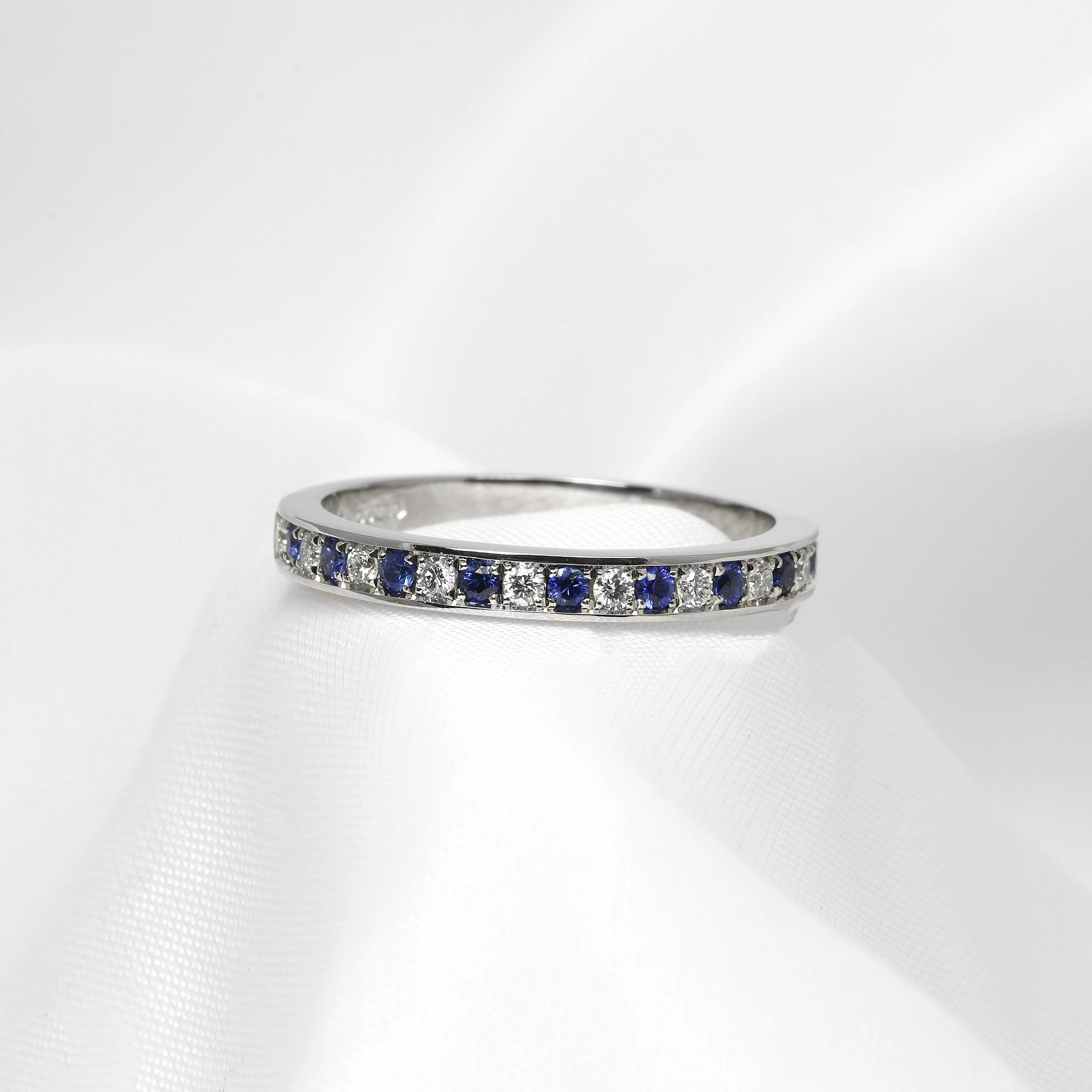 Sapphire and Diamond Half Eternity Ring in Platinum