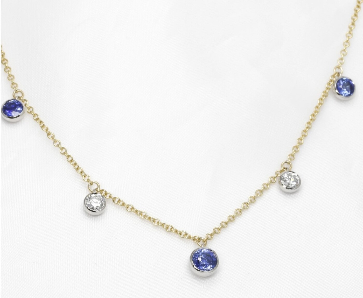 Sapphire and Diamond Station Drop Necklace in Platinum and Yellow Gold