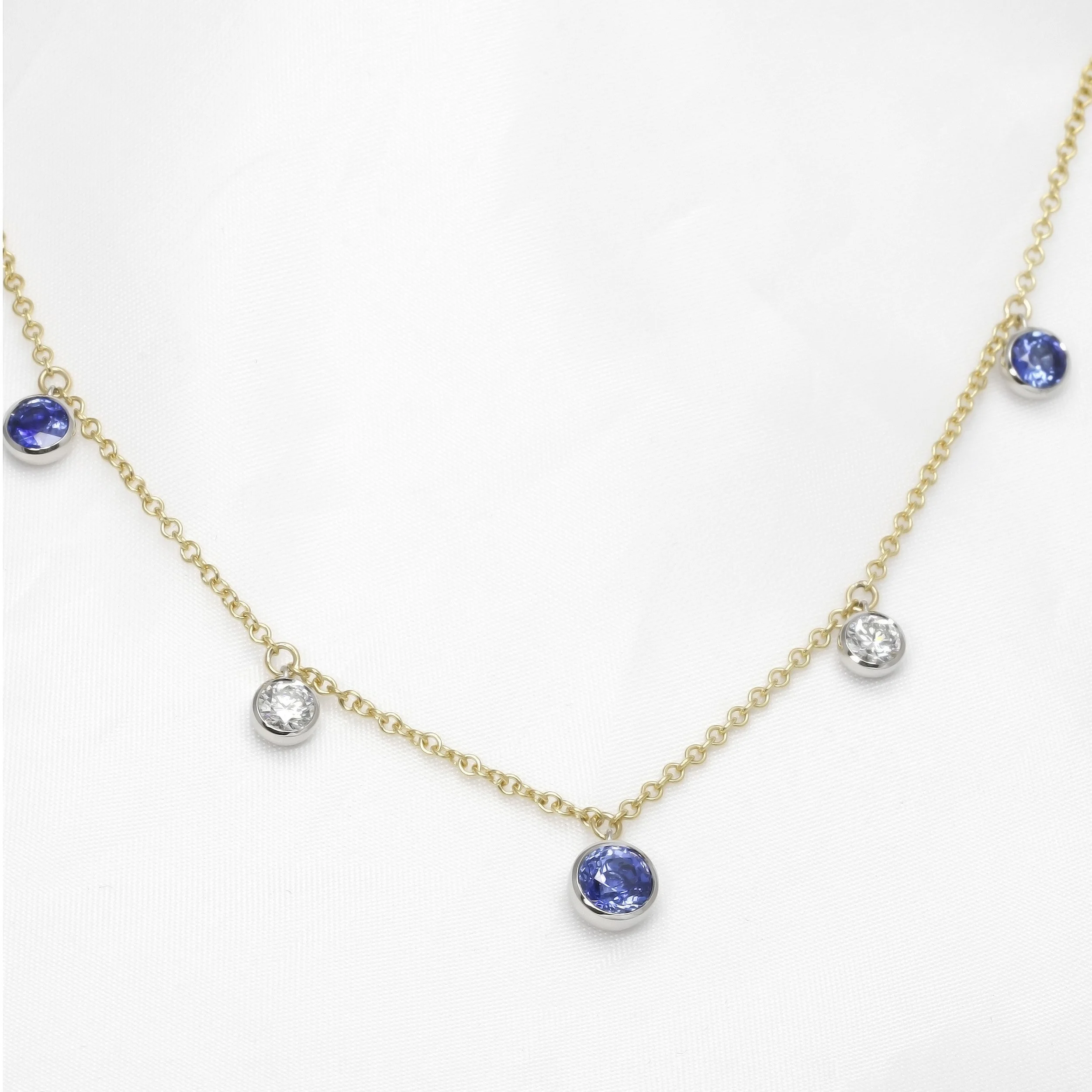 Sapphire and Diamond Station Drop Necklace in Platinum and Yellow Gold