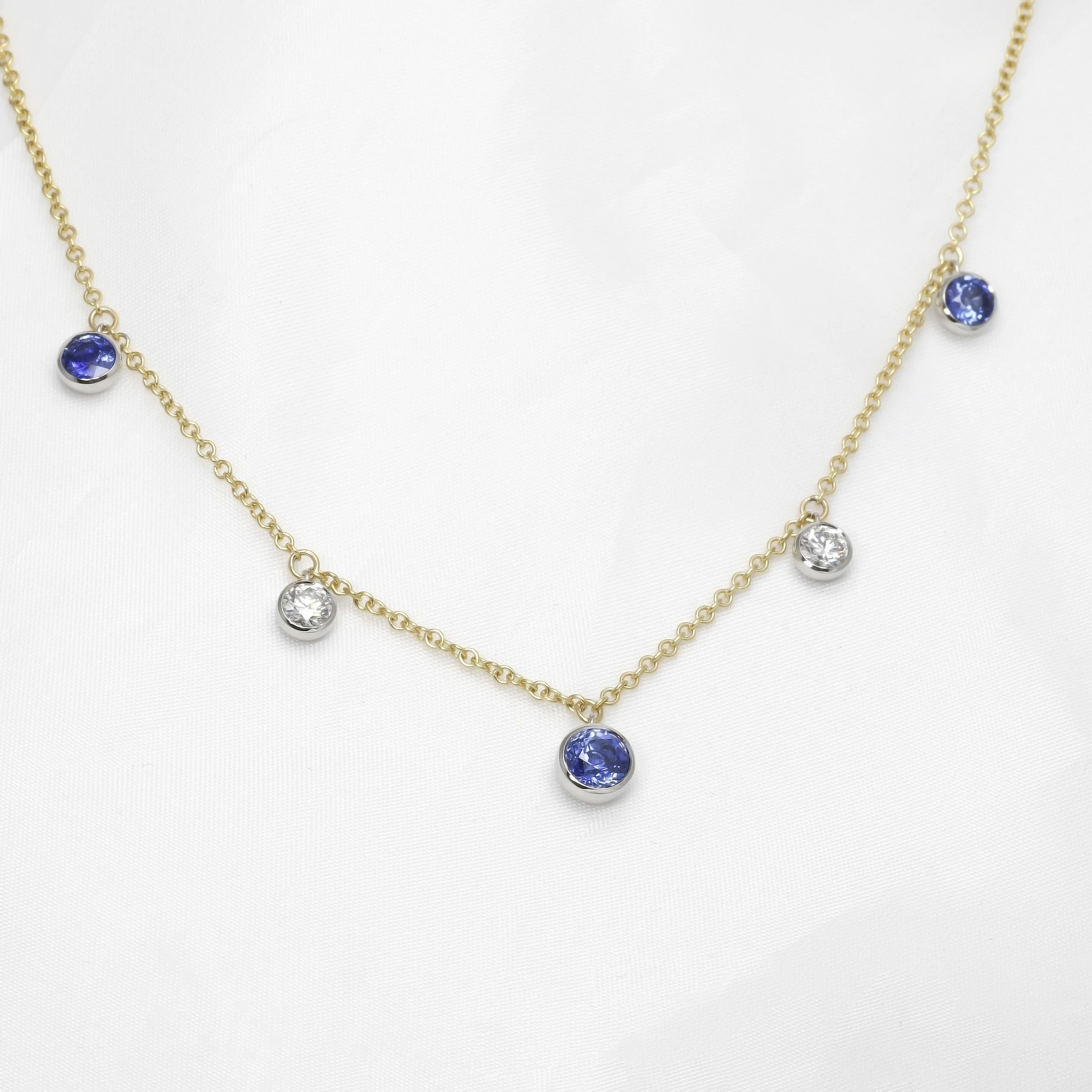 Sapphire and Diamond Station Drop Necklace in Platinum and Yellow Gold