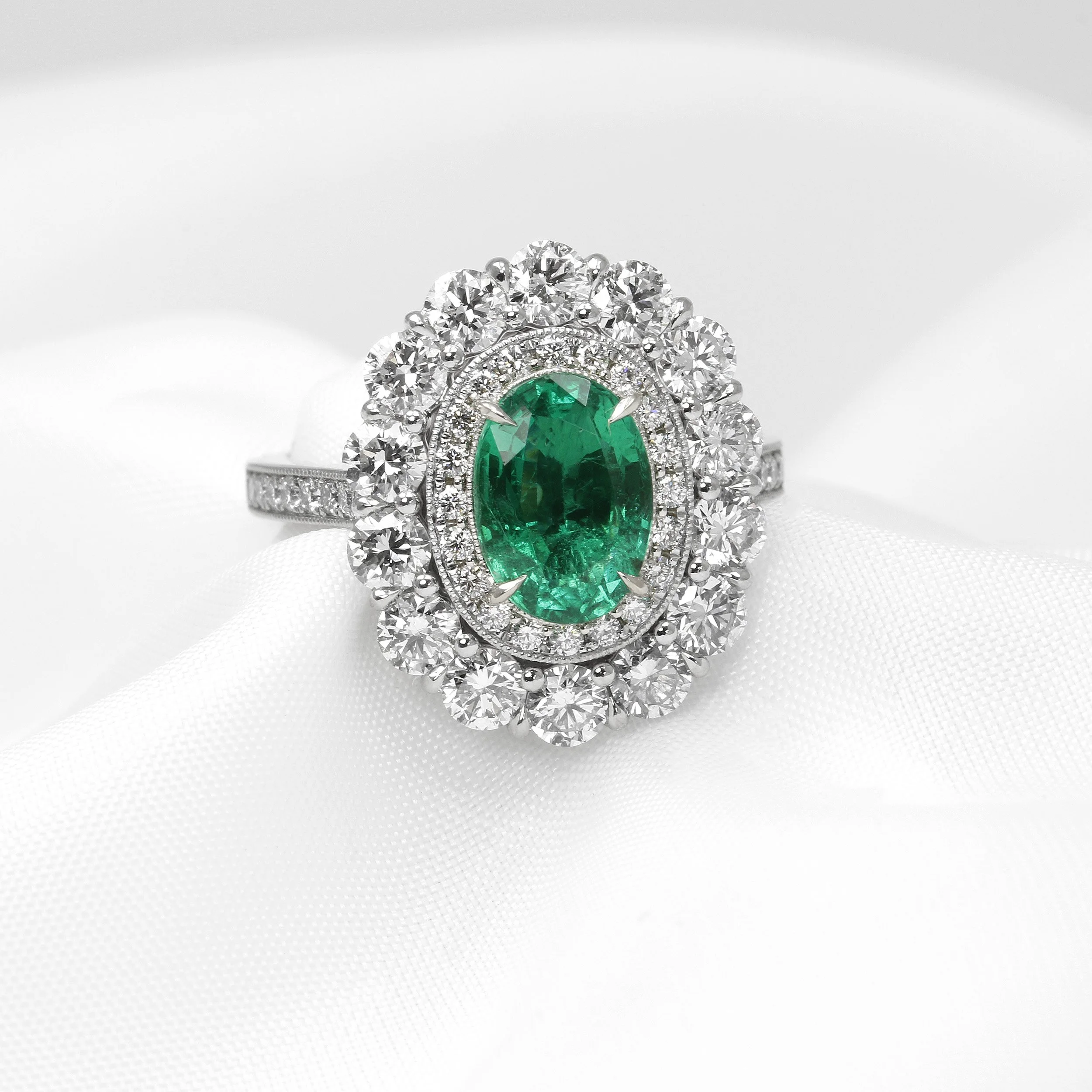 Emerald and Diamond Double Halo Ring in Platinum