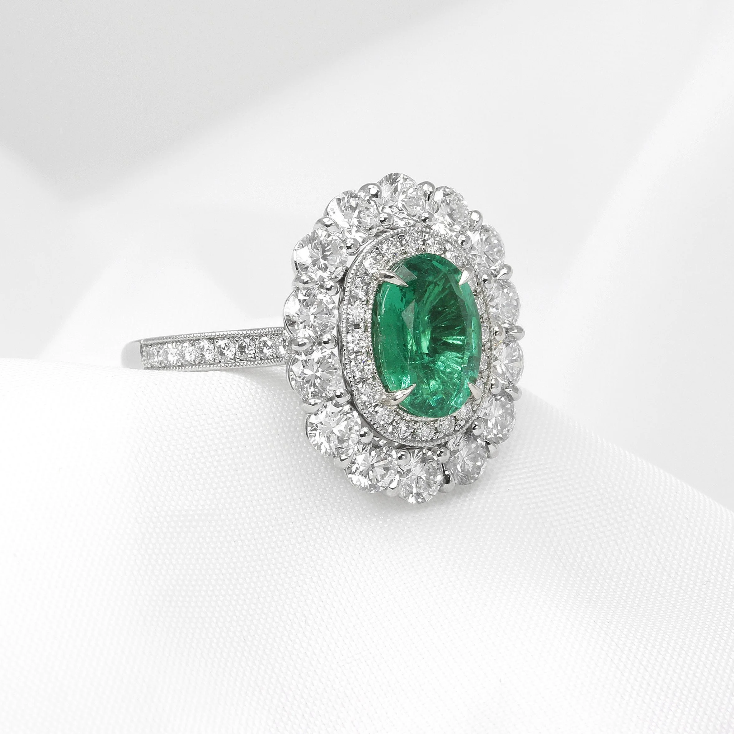 Emerald and Diamond Double Halo Ring in Platinum