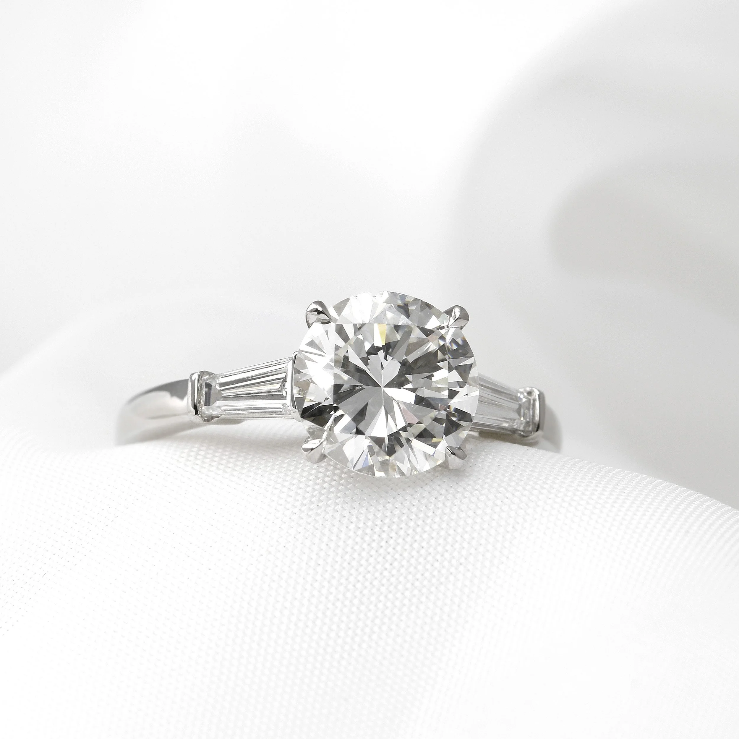 Solitaire Diamond Ring with Baguette Shoulders in Platinum