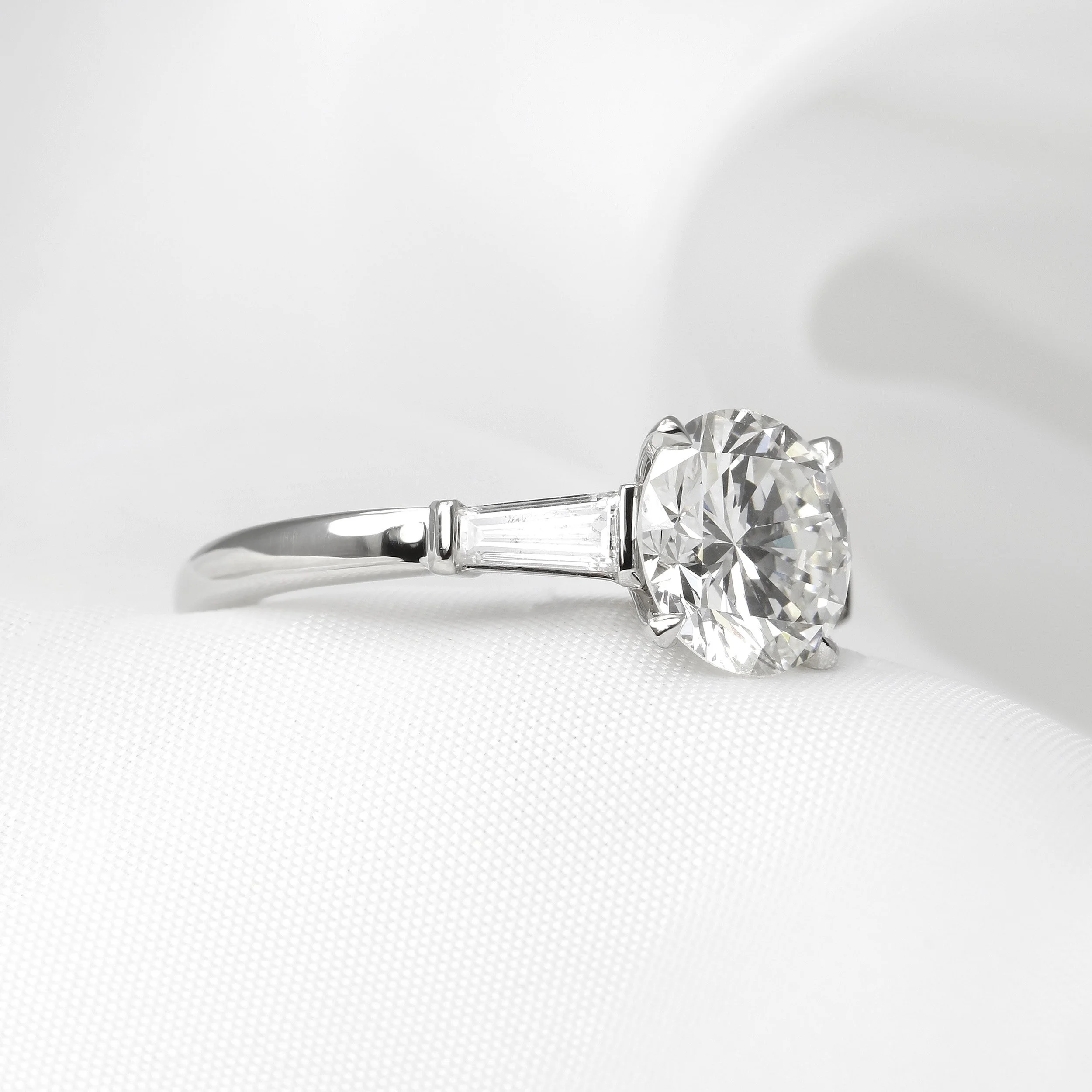 Solitaire Diamond Ring with Baguette Shoulders in Platinum