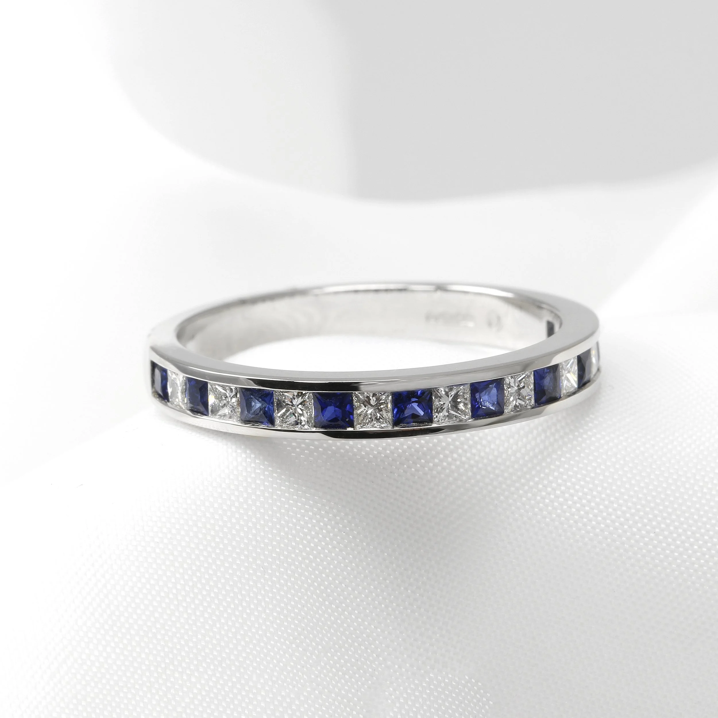 Diamond and Sapphire Half Eternity Ring in Platinum