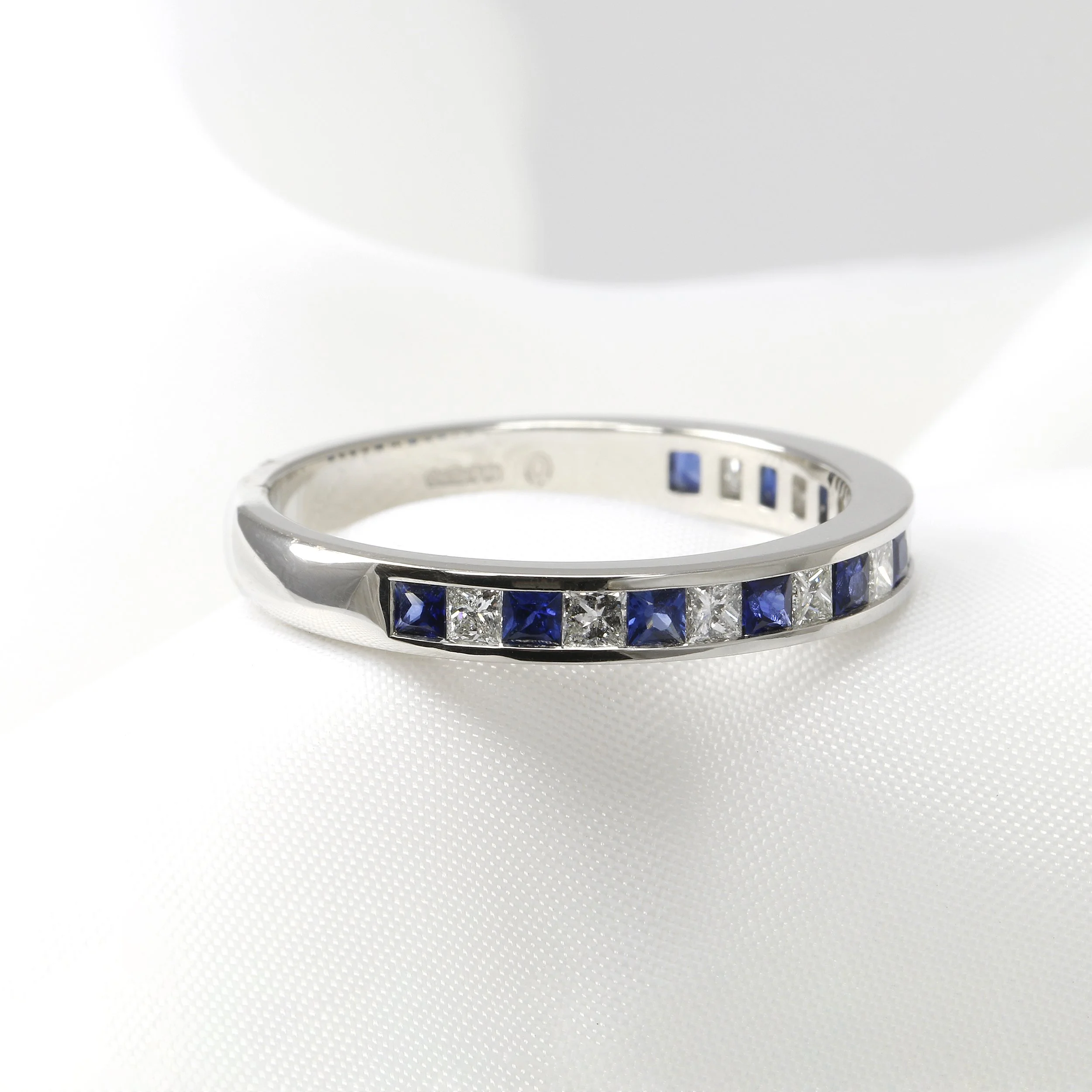 Diamond and Sapphire Half Eternity Ring in Platinum