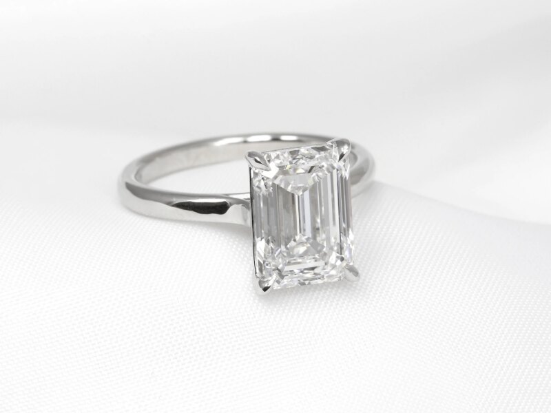 lab-created diamond solitaire ring, set with a central 4.00ct certificated lab-created emerald cut diamond. This ring has been handcrafted in platinum with a talon claw style setting.