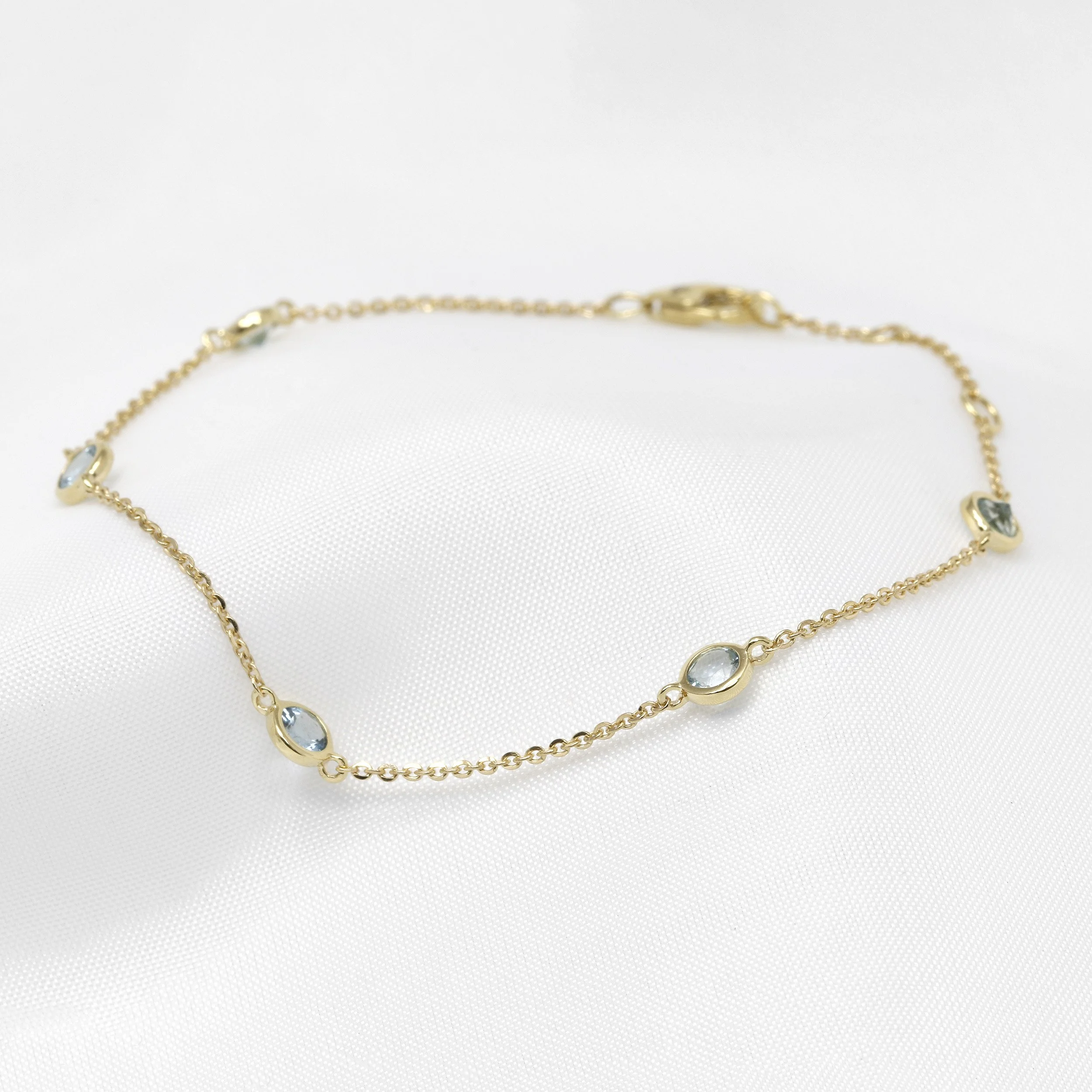 Aquamarine Station Bracelet in Yellow Gold