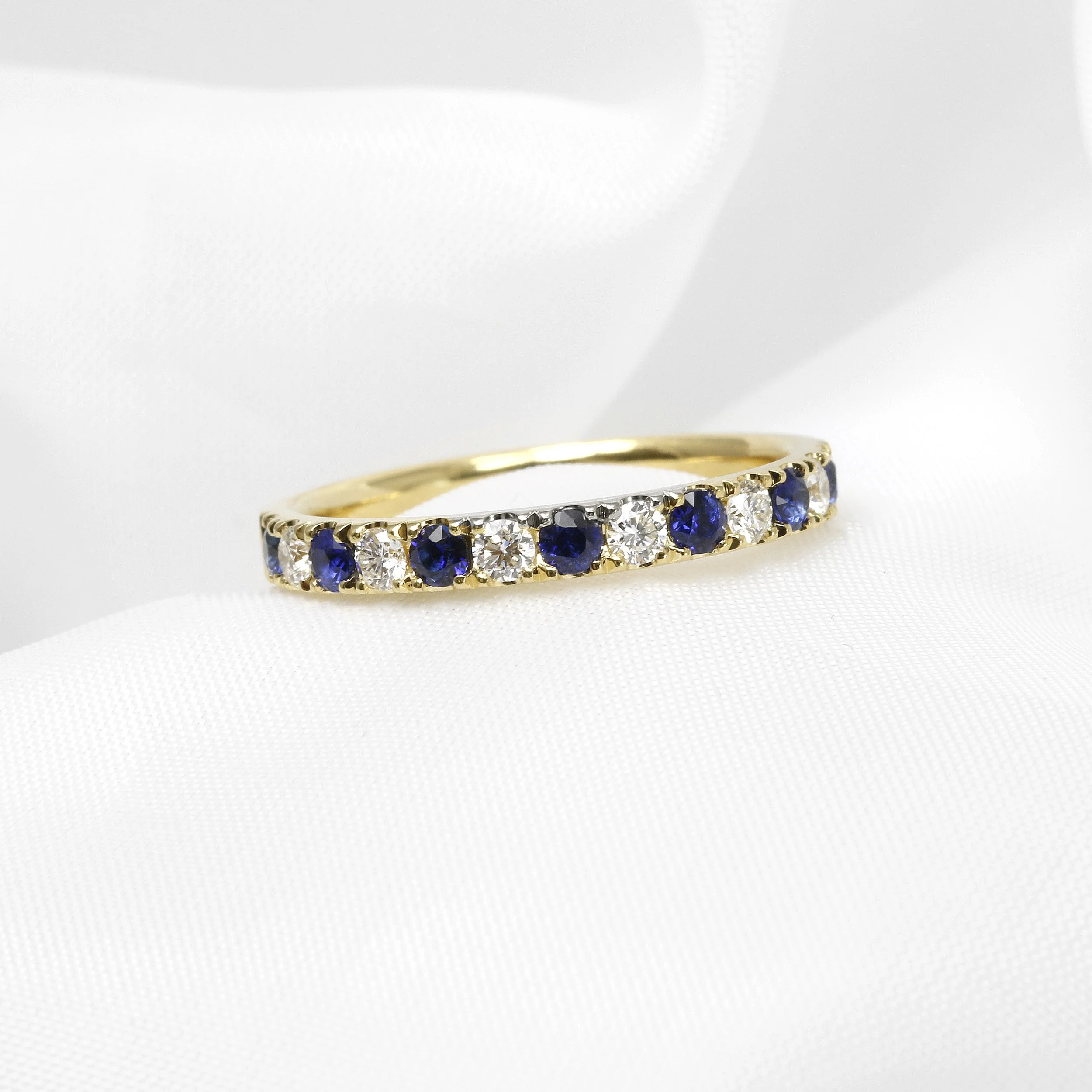 Claw Set Sapphire and Diamond Eternity Ring in Yellow Gold