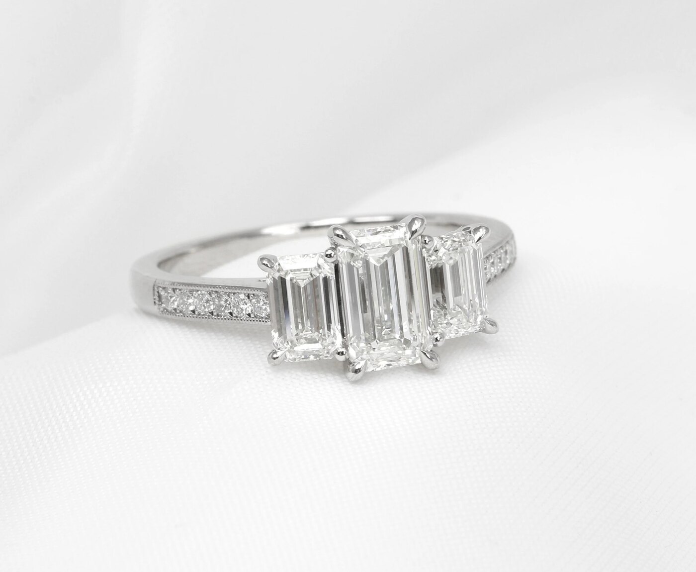 Emerald Cut Three Stone Ring in Platinum 