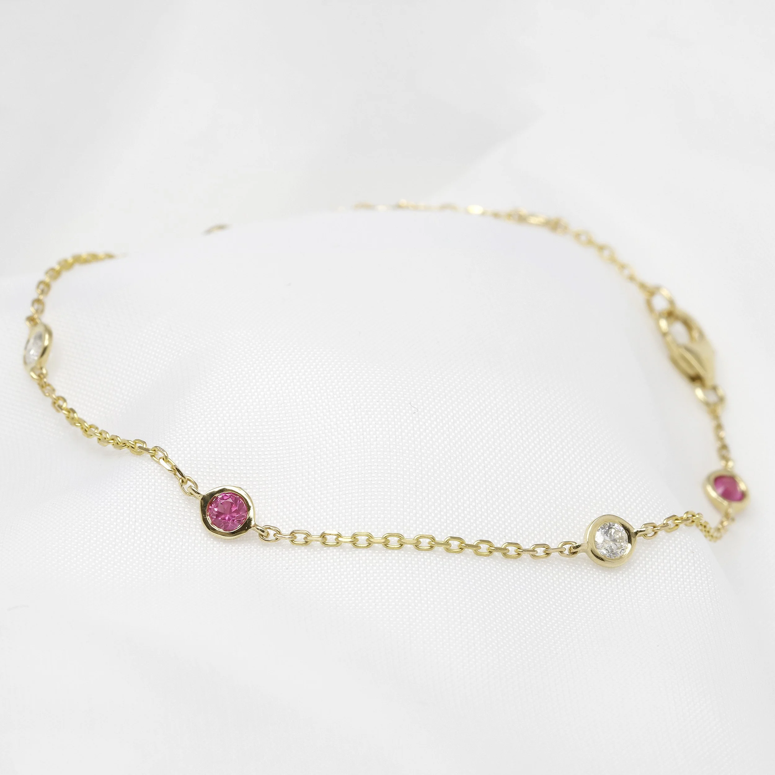 Pink Sapphire and Diamond Station Bracelet in 9ct Yellow Gold