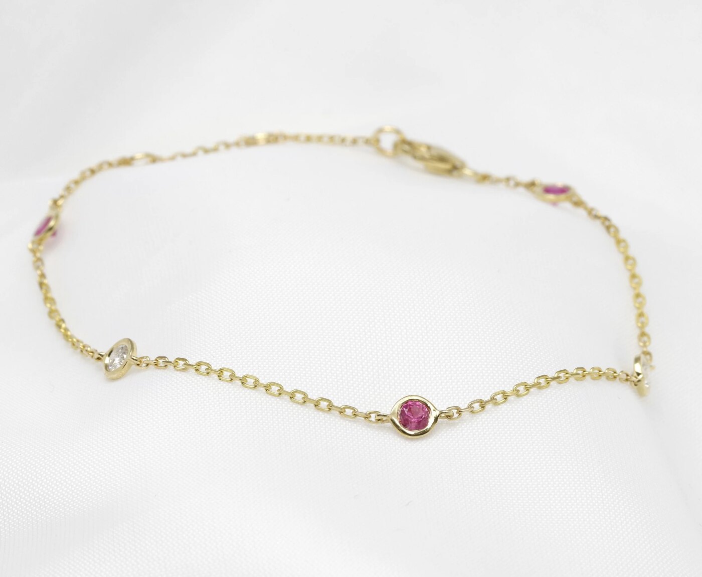 Pink Sapphire and Diamond Station Bracelet in 9ct Yellow Gold 