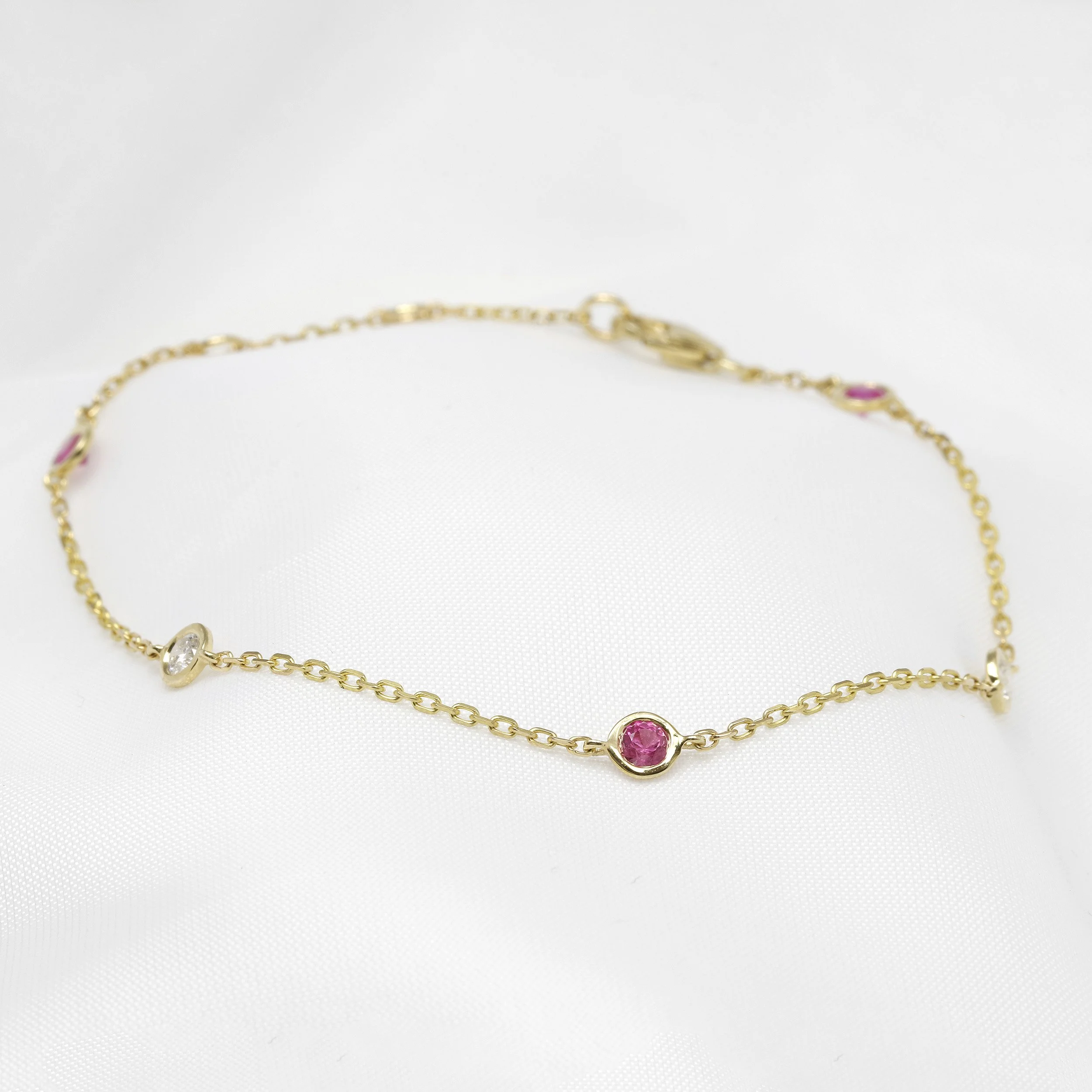 Pink Sapphire and Diamond Station Bracelet in 9ct Yellow Gold