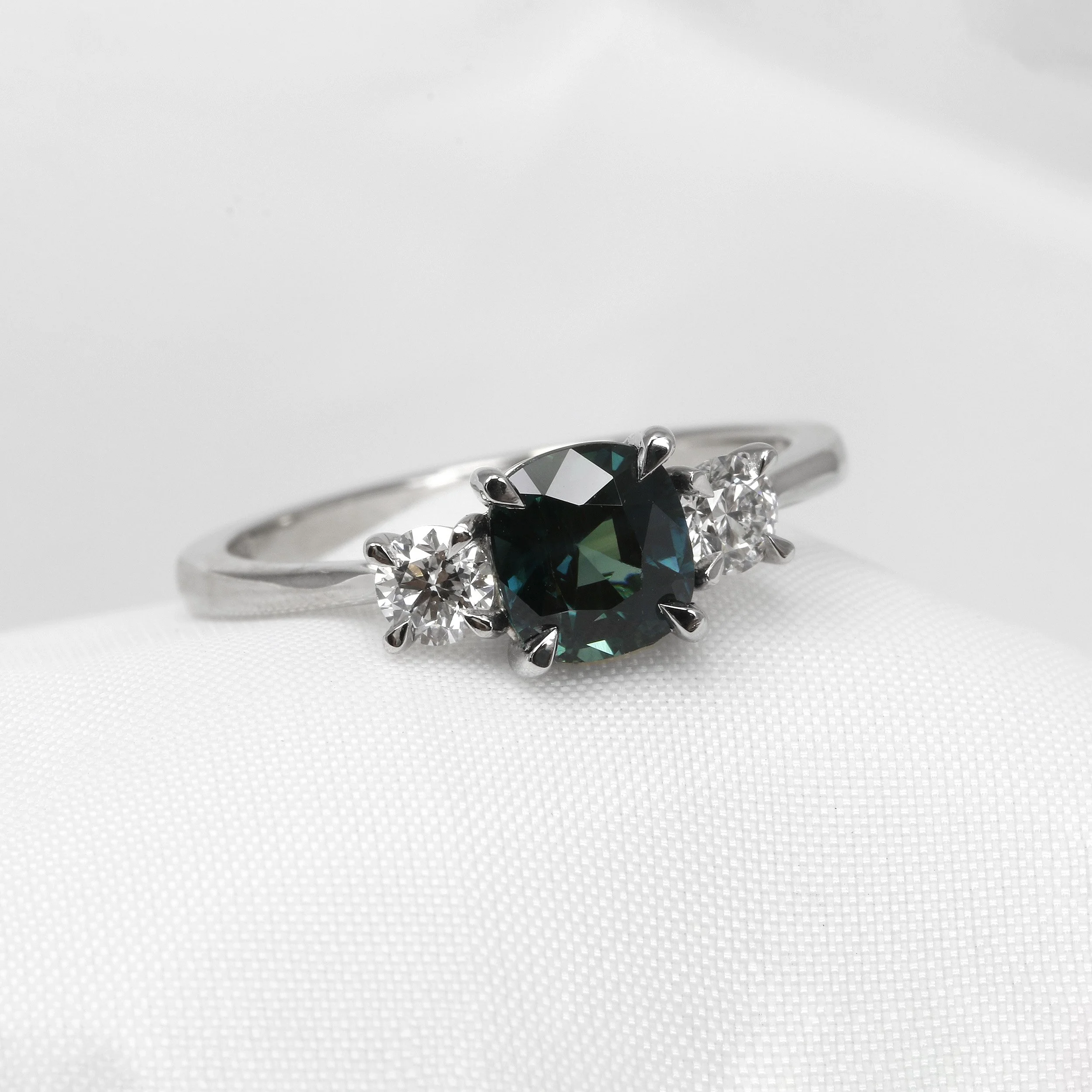 Teal Sapphire And Diamond Three Stone Ring in Platinum