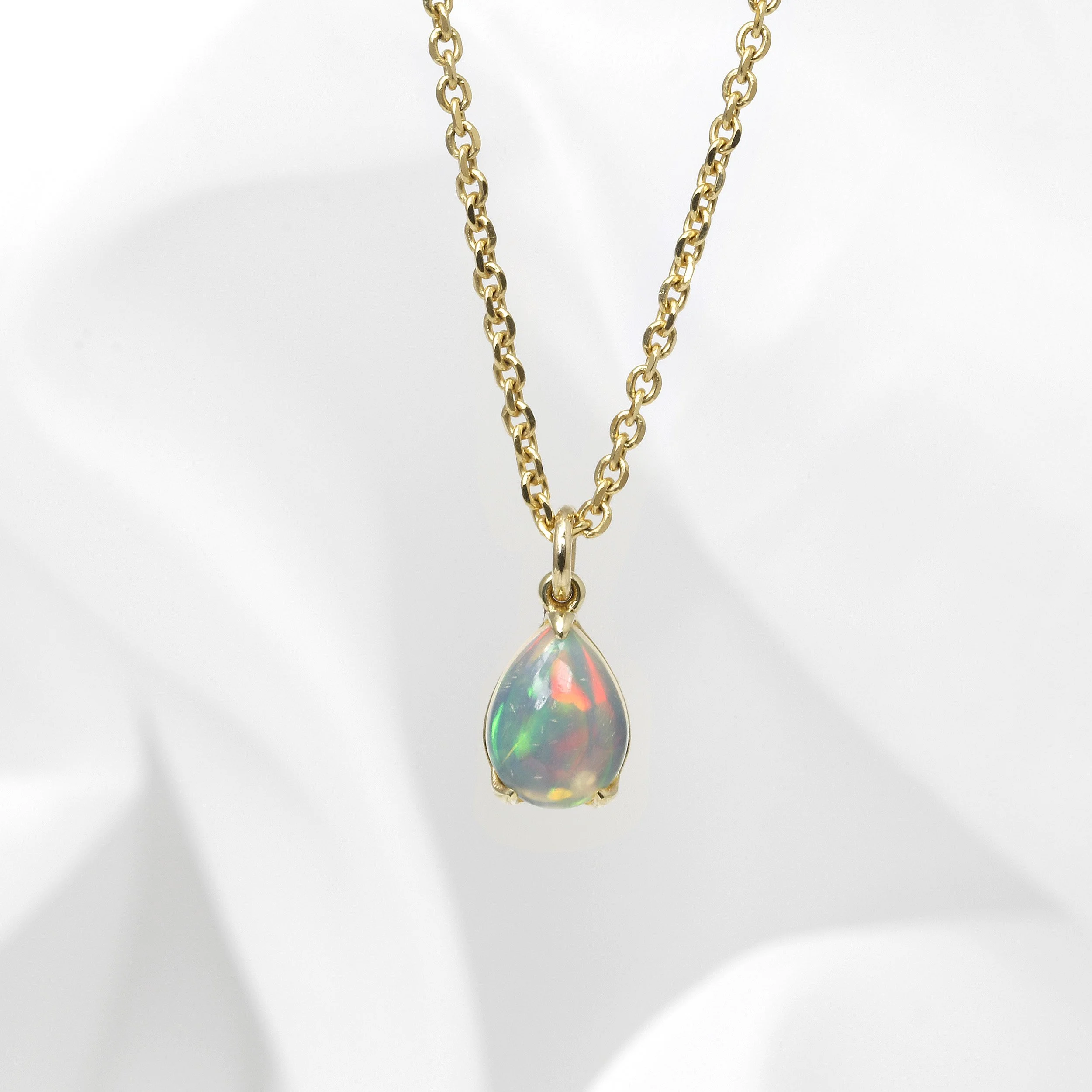 Opal Claw Set Pendant in Yellow Gold