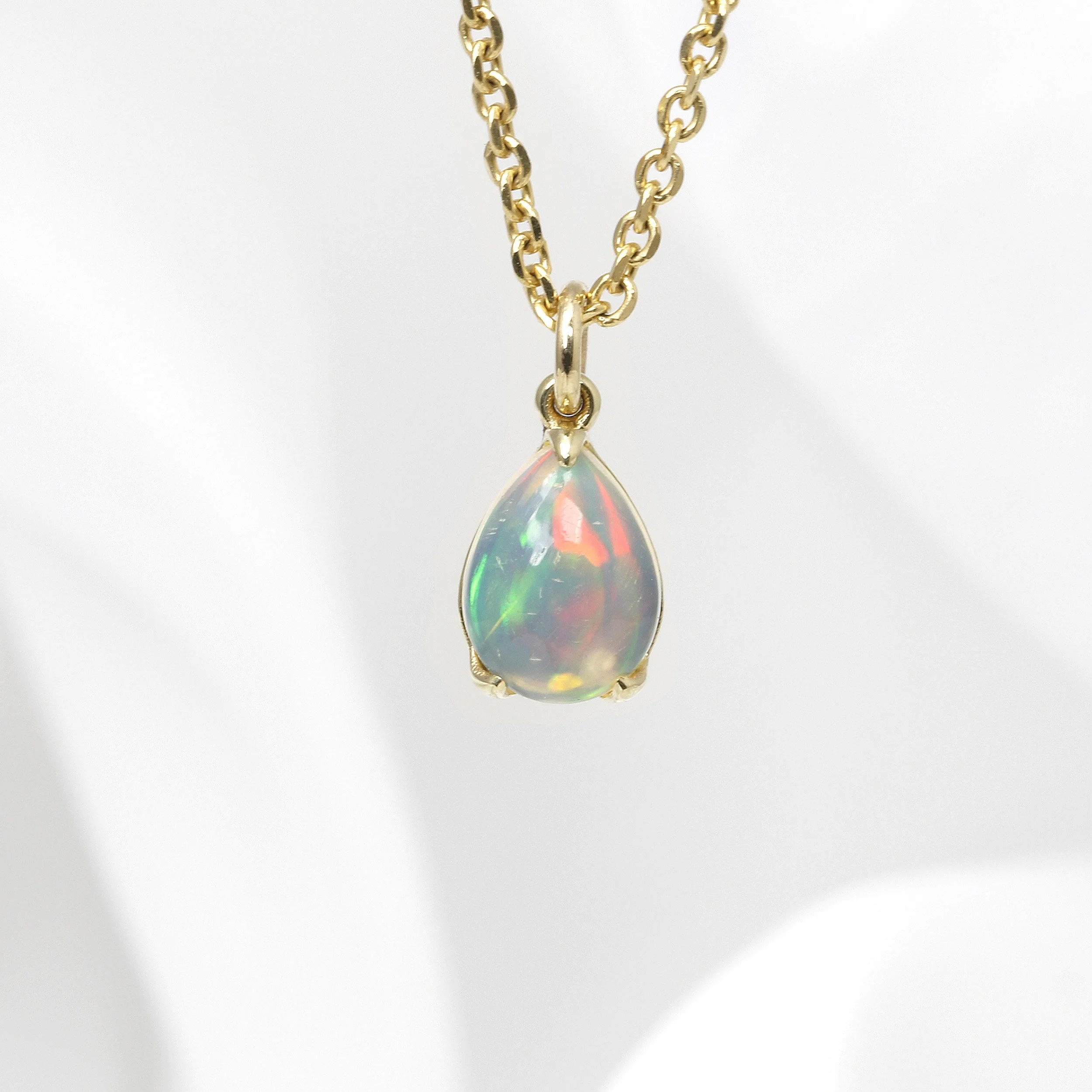 Opal Claw Set Pendant in Yellow Gold