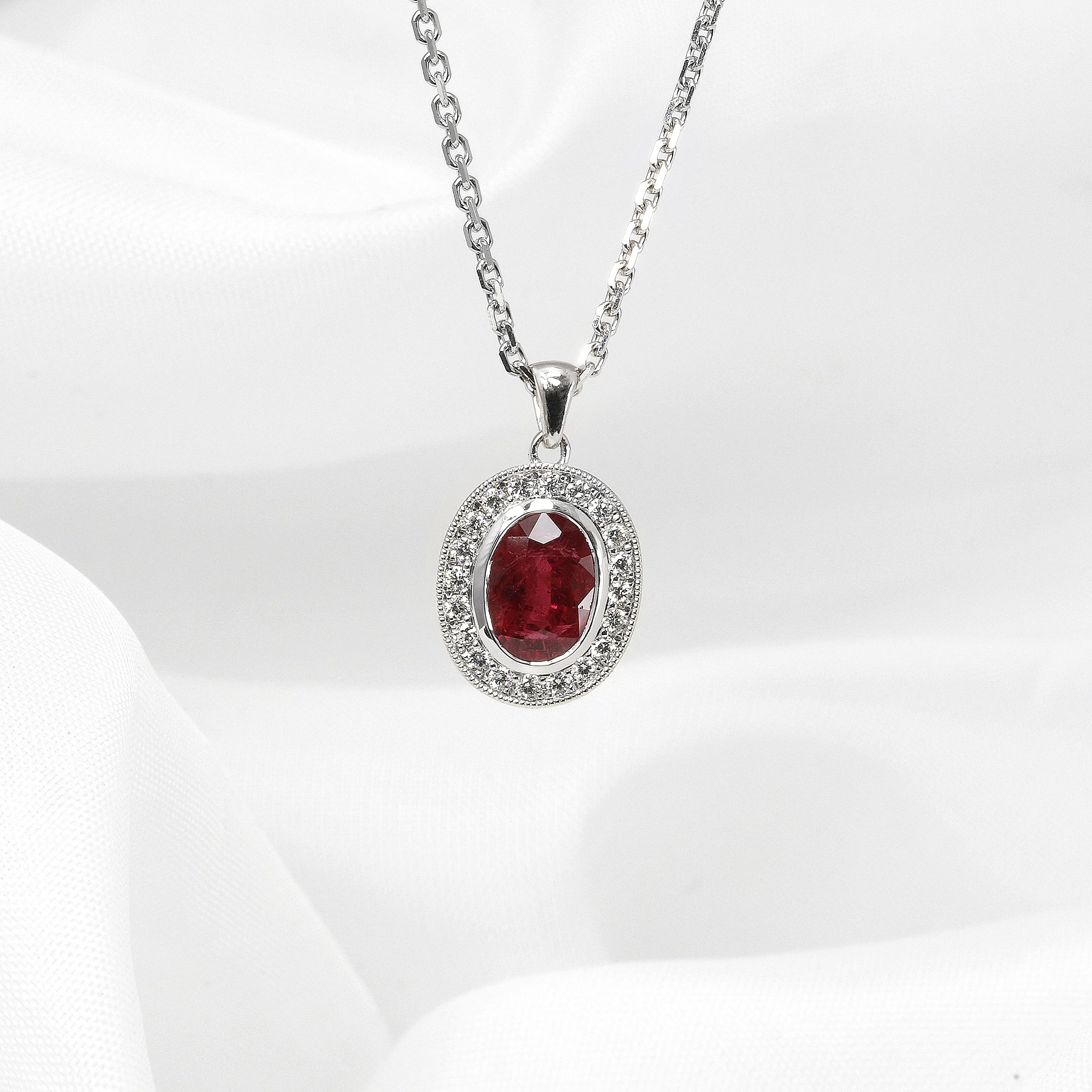 Ruby and Diamond Halo Pendant in White Gold