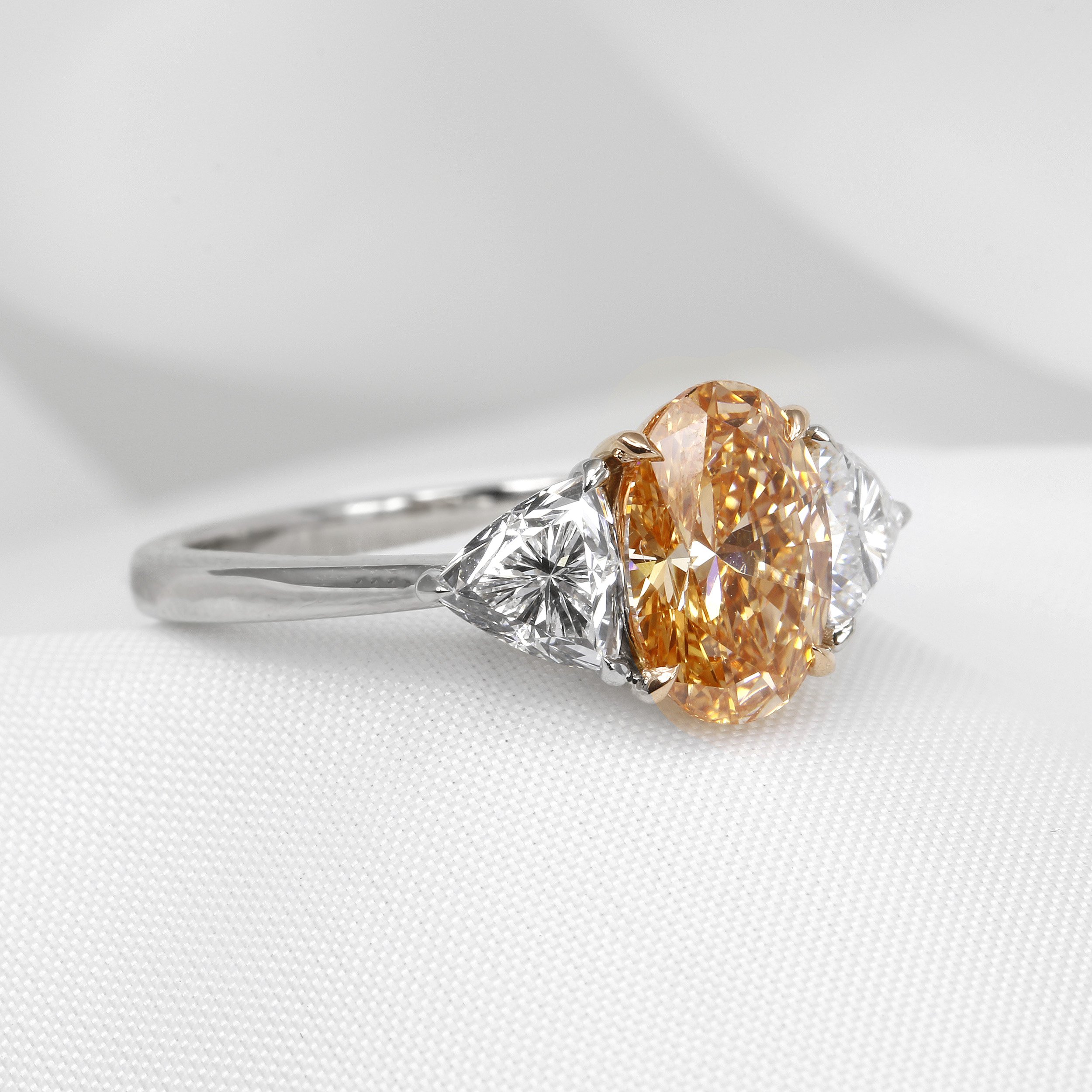 Lab Created Orange Oval and Trilliant Cut Diamond Three Stone Ring