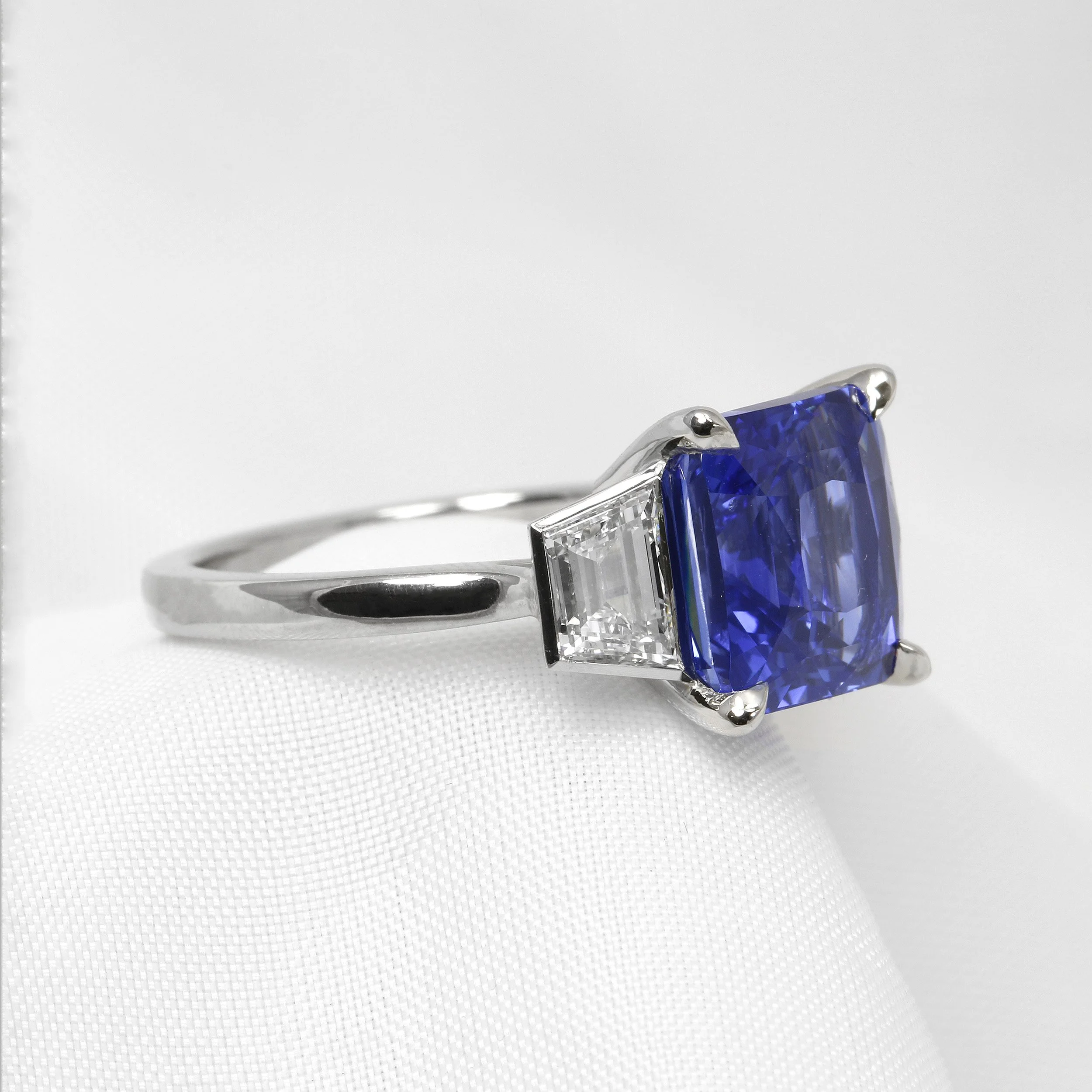 Cushion Sapphire and Trapeze Diamond Three Stone Ring