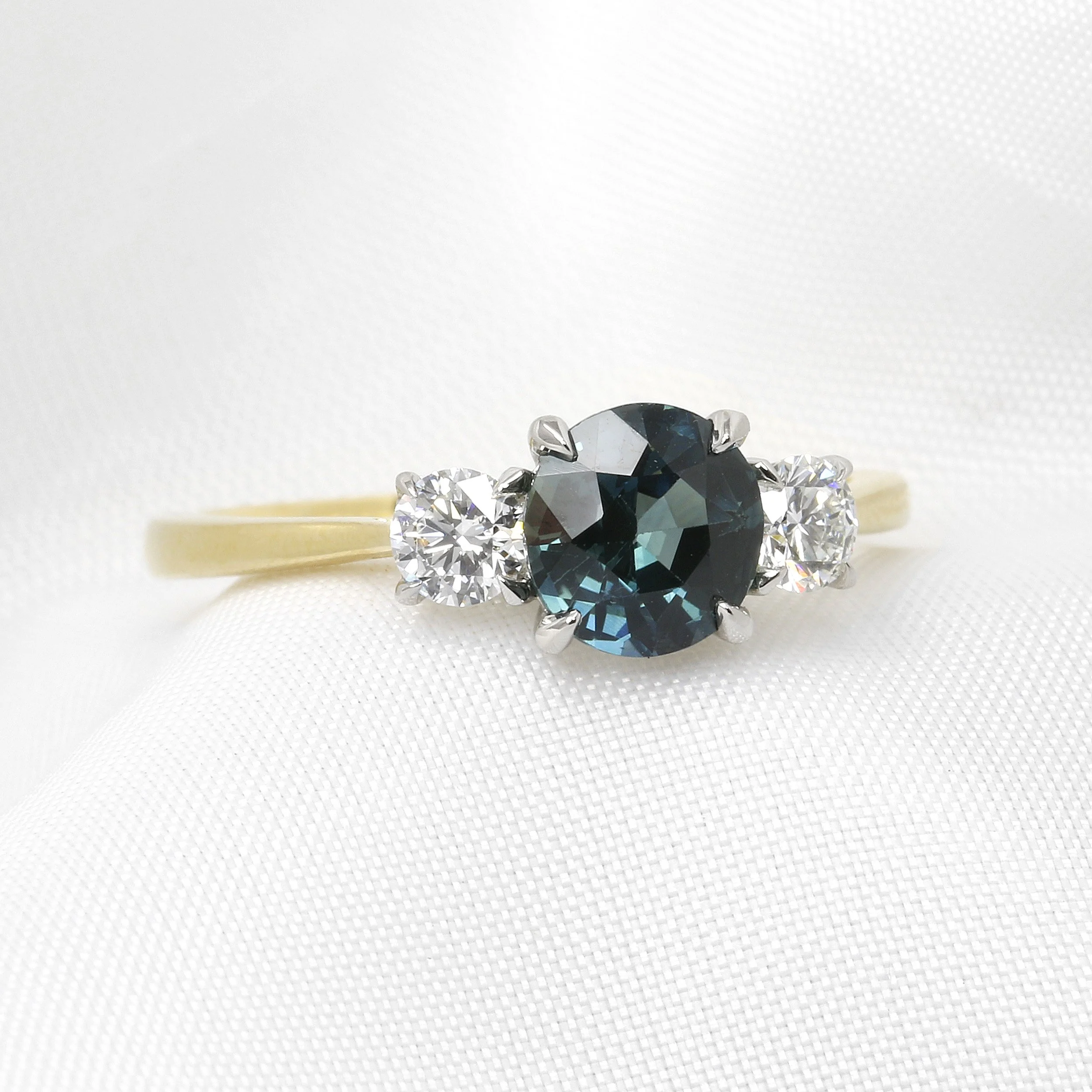 Teal Sapphire and Diamond Three Stone Ring in Platinum and 18ct Yellow Gold