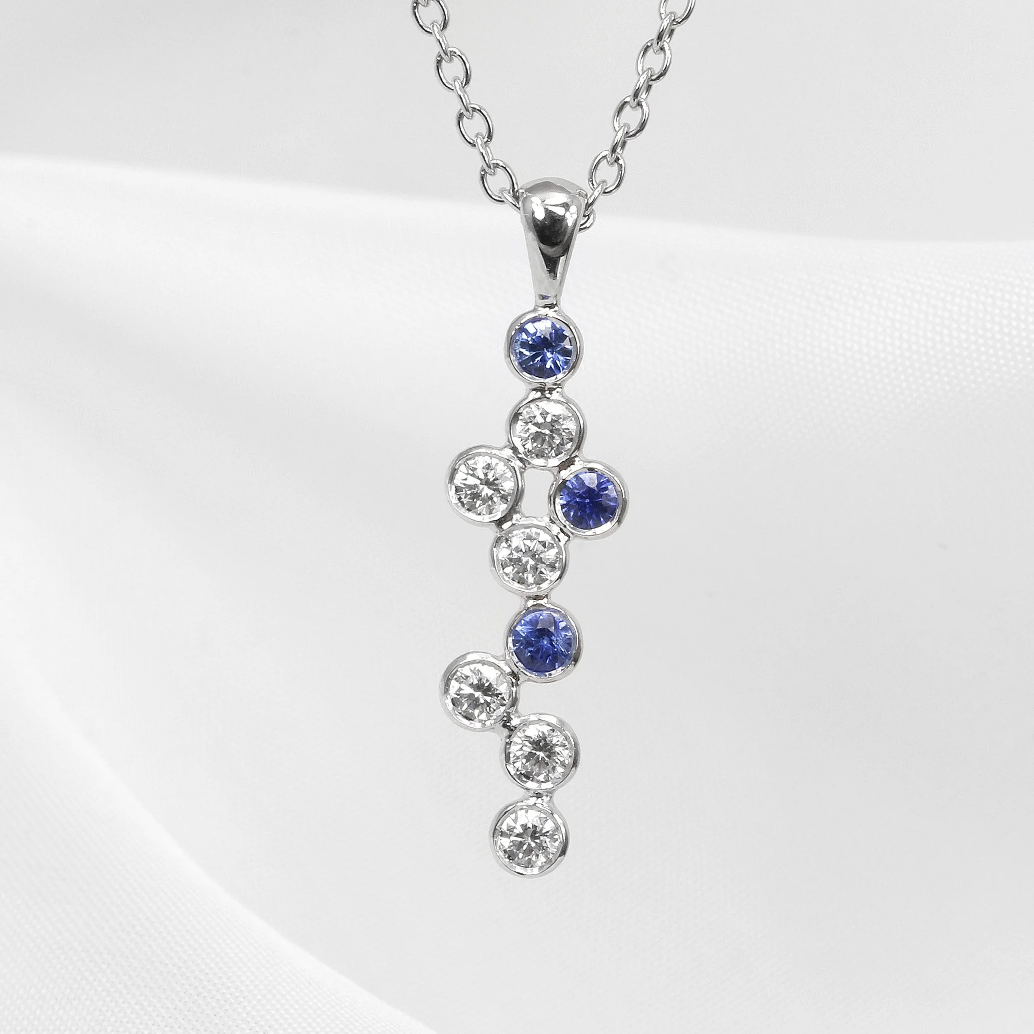 Sapphire and Diamond Drop Pendant in Platinum and White Gold