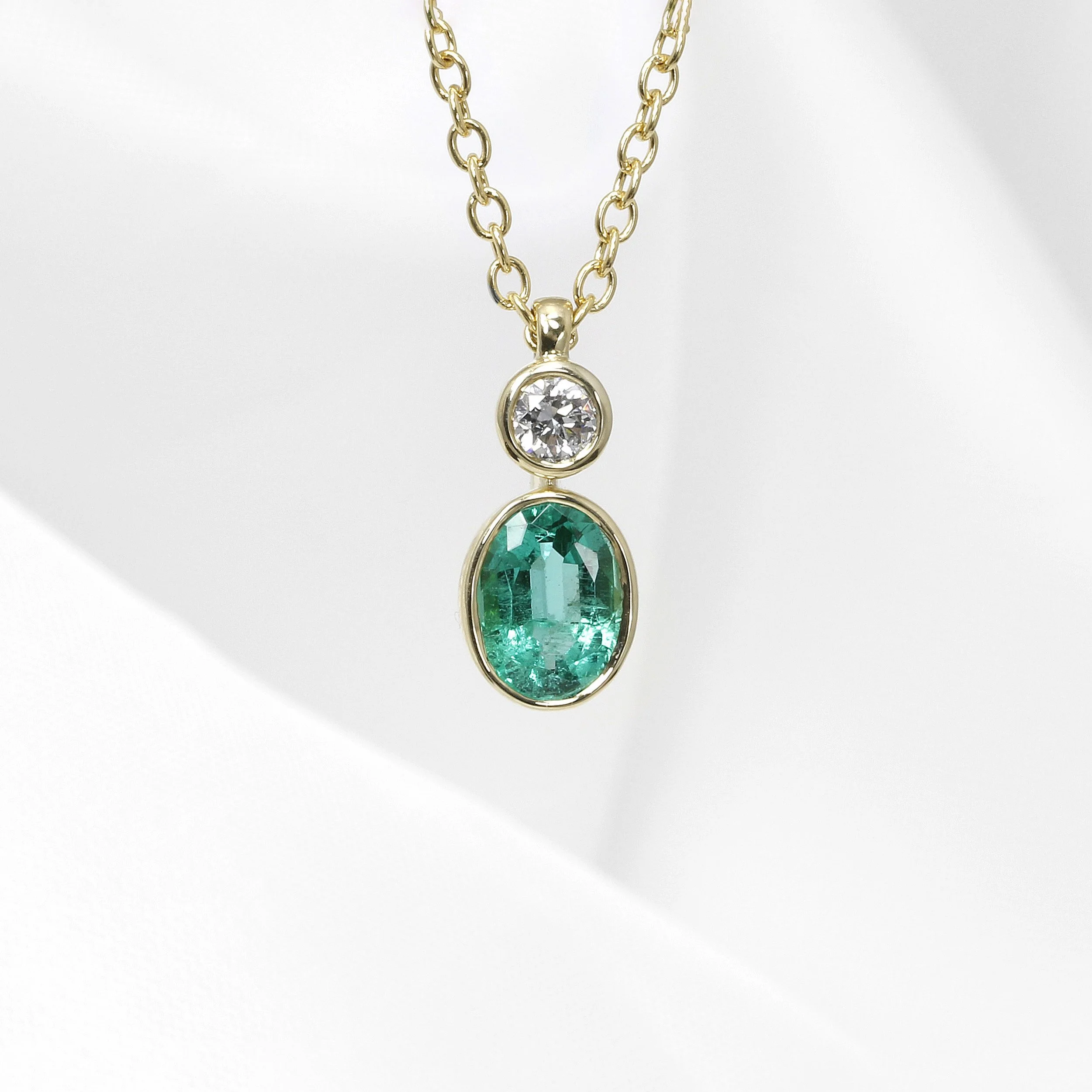 Emerald and Diamond Pendant in Yellow Gold