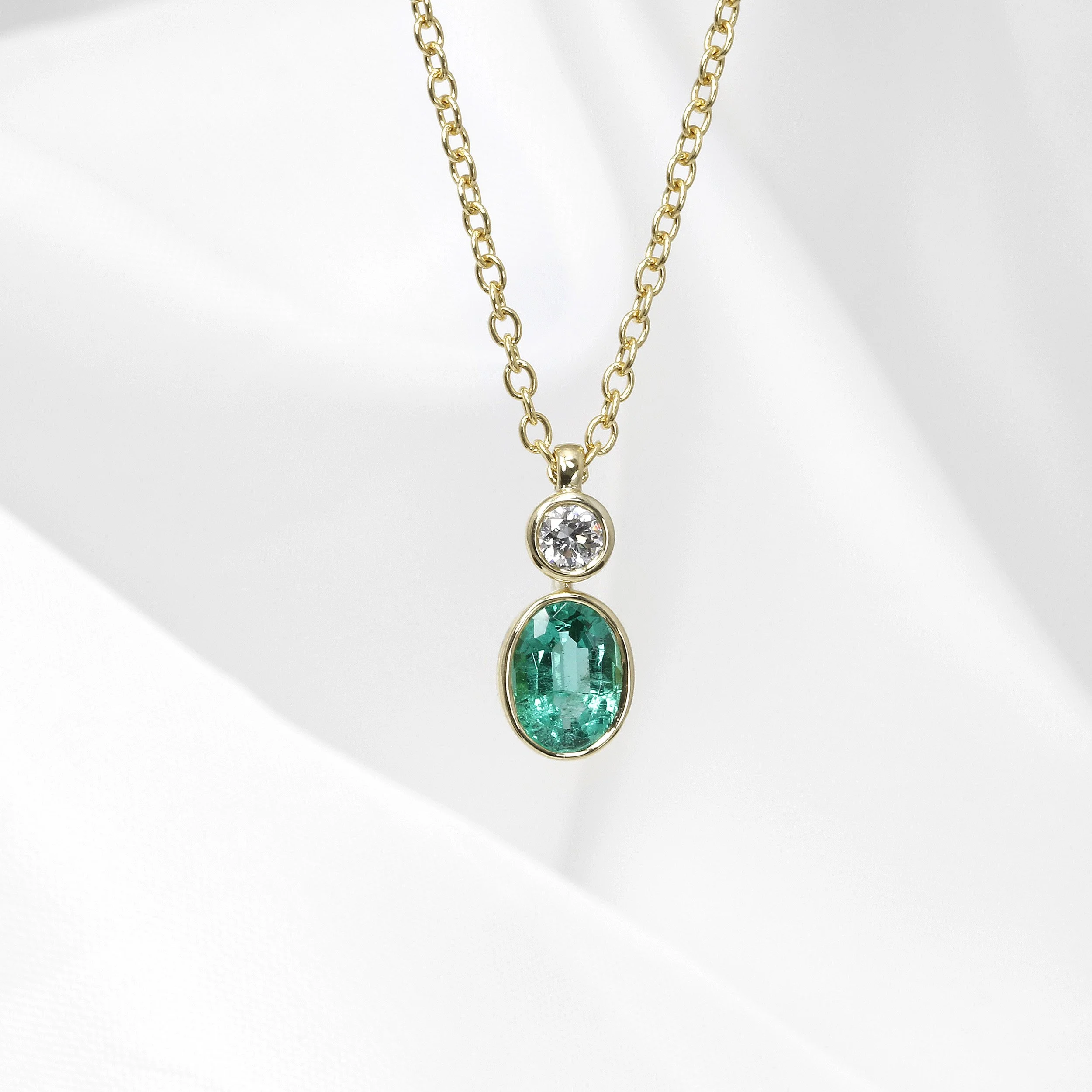 Emerald and Diamond Pendant in Yellow Gold