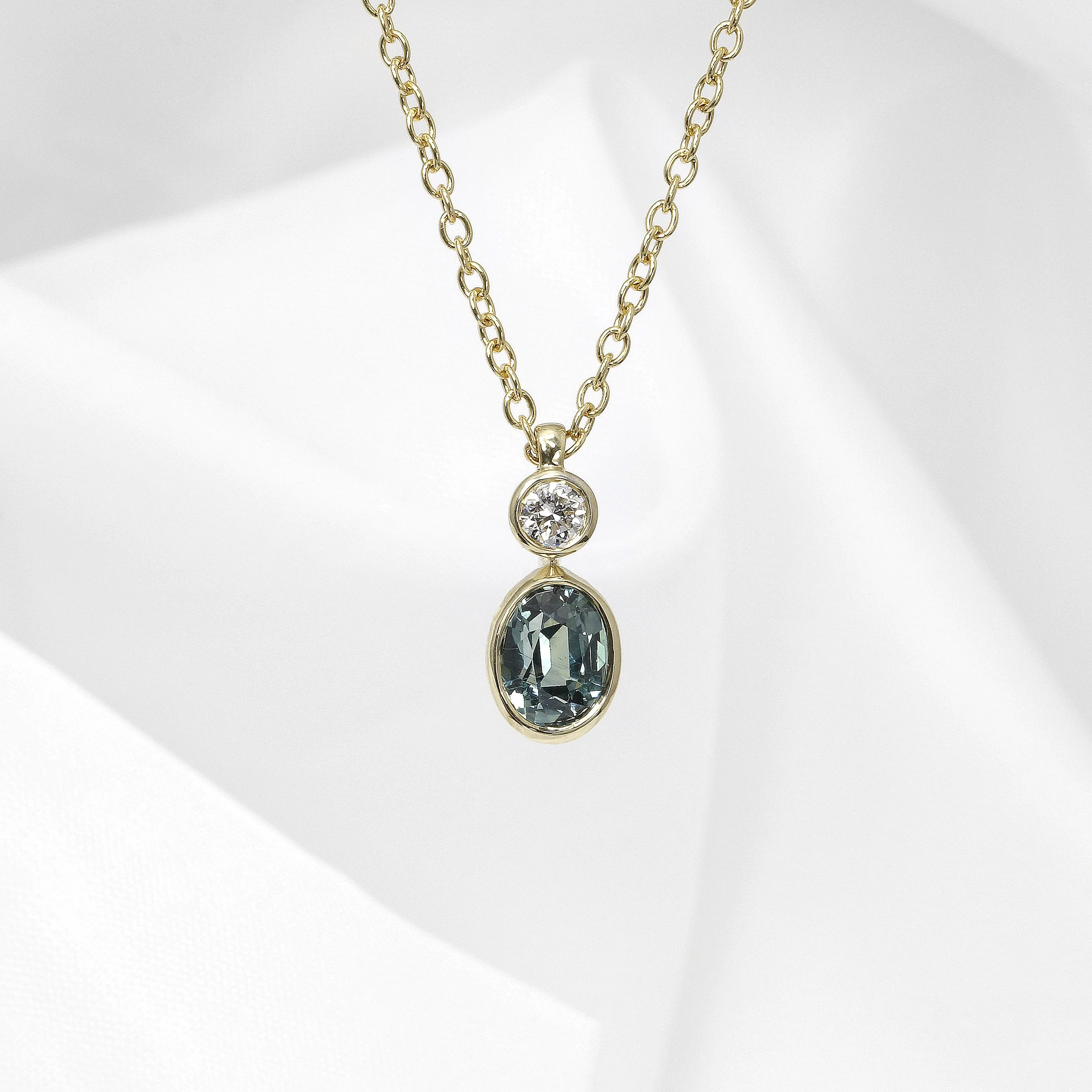 Teal Sapphire and Diamond Pendant in Yellow Gold