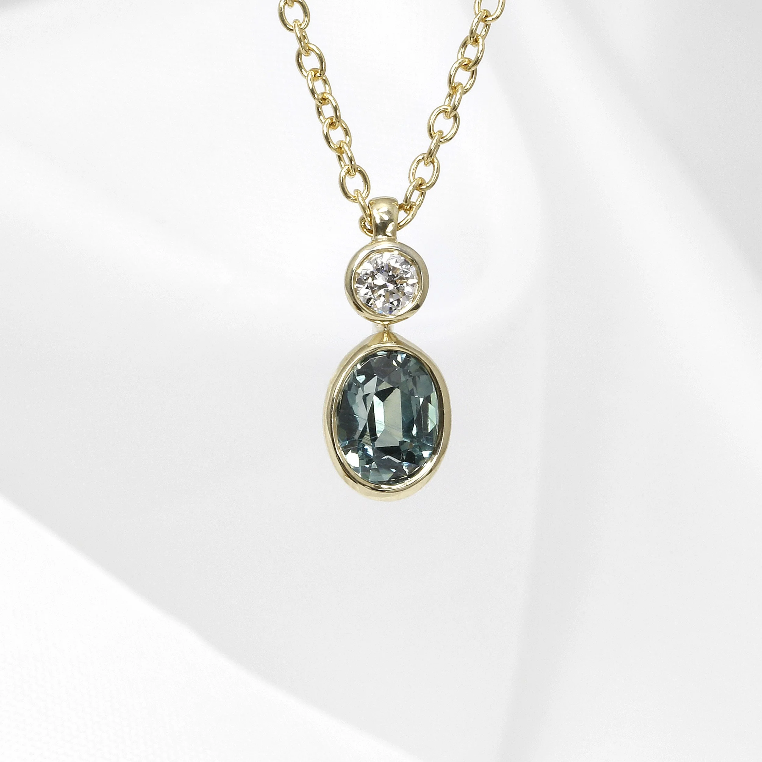 Teal Sapphire and Diamond Pendant in Yellow Gold