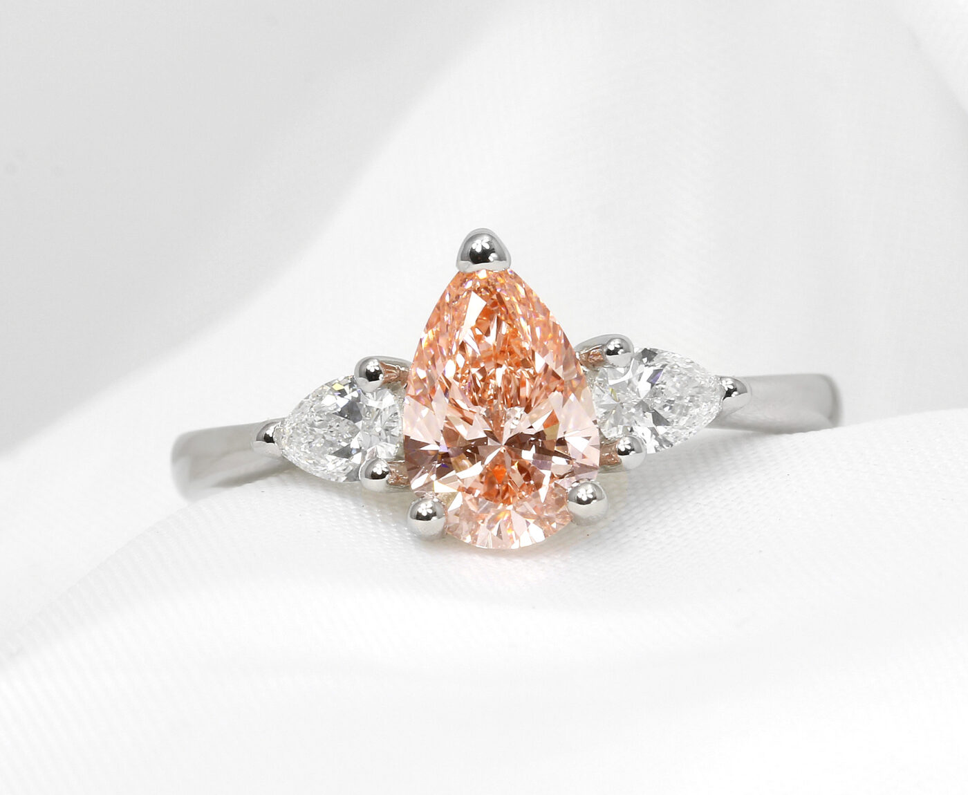 Laboratory Created Pink Pear Shape Diamond Three Stone Ring
