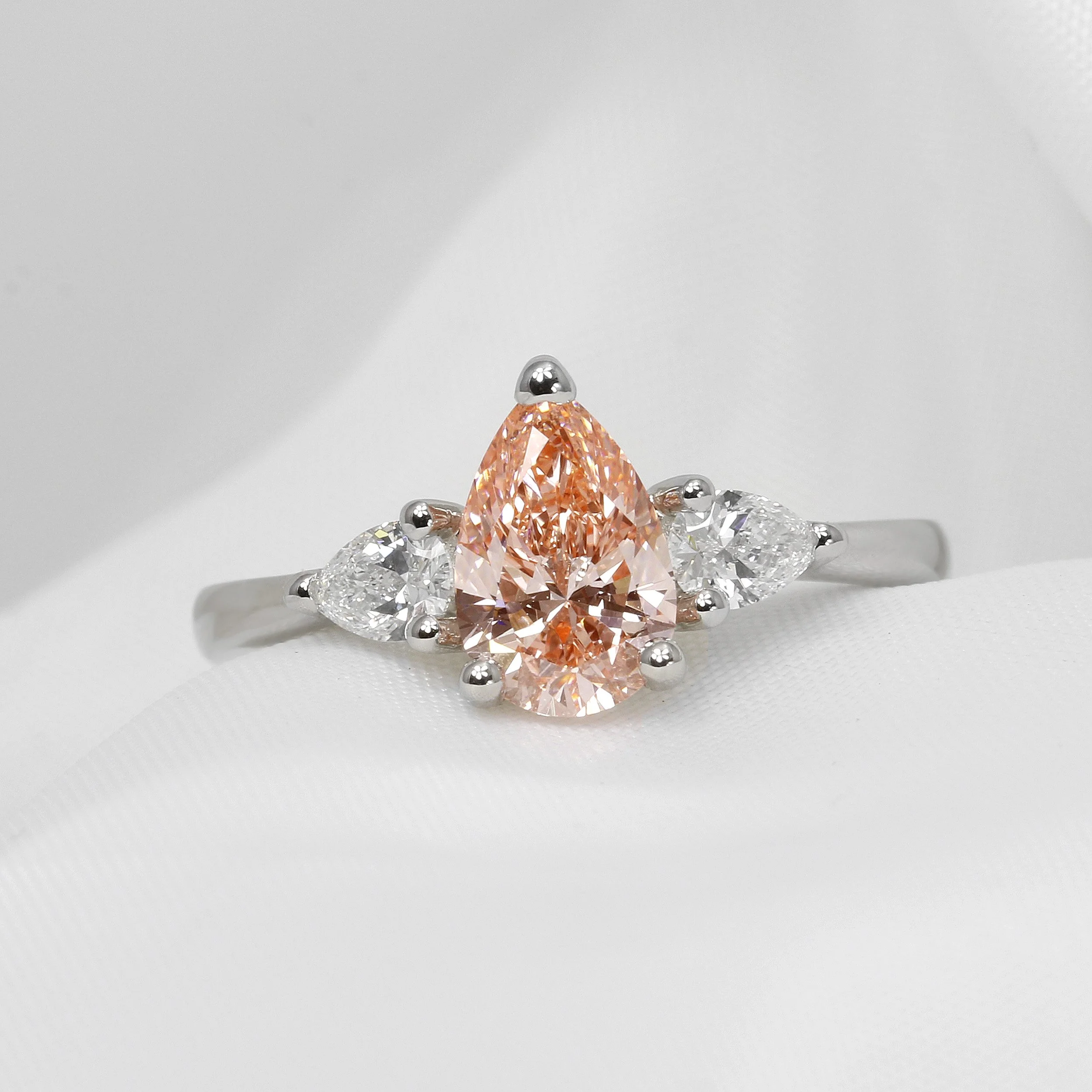 Laboratory Created Pink Pear Shape Diamond Three Stone Ring