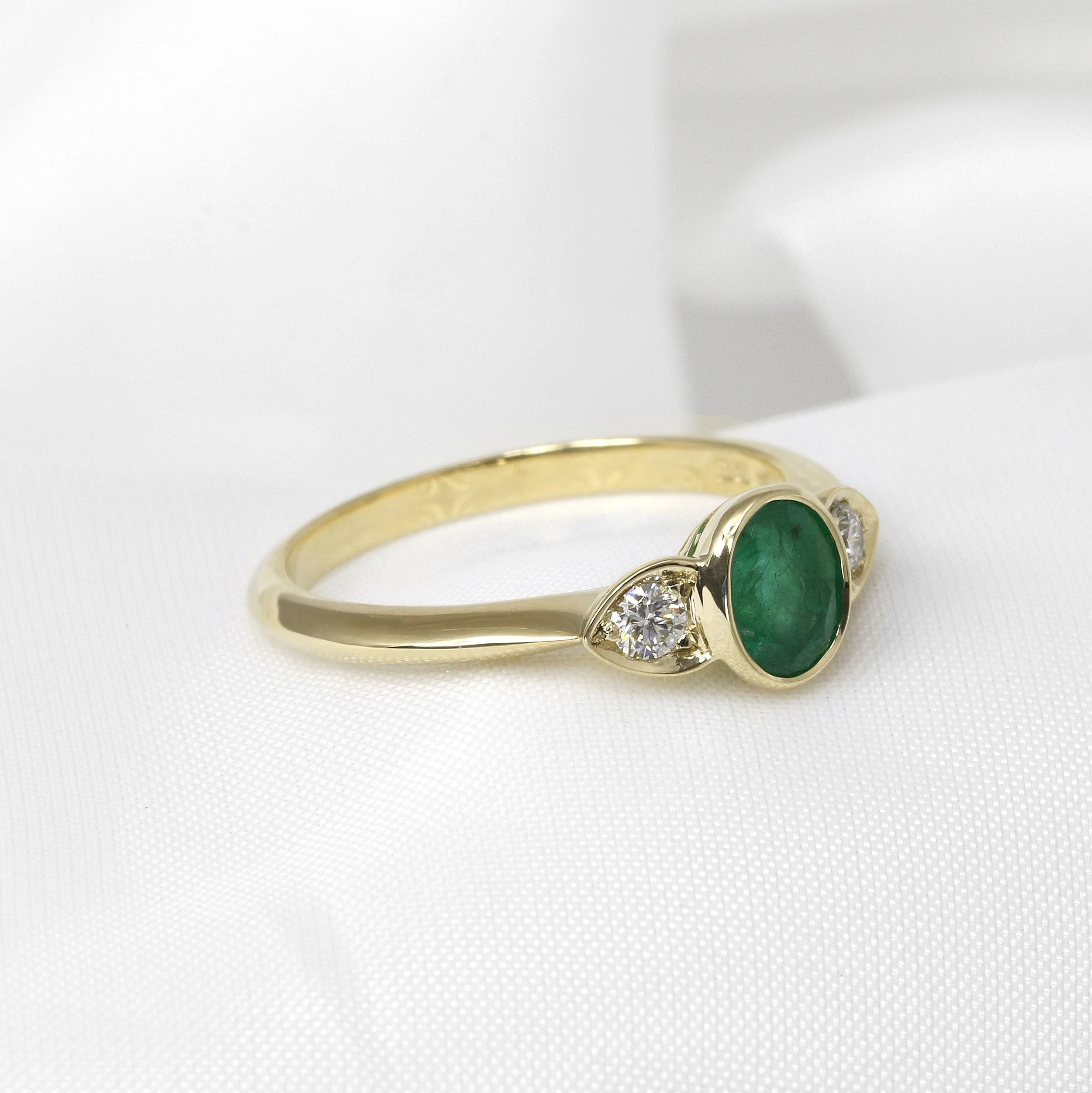 Oval Emerald and Diamond Three Stone Ring in Yellow Gold