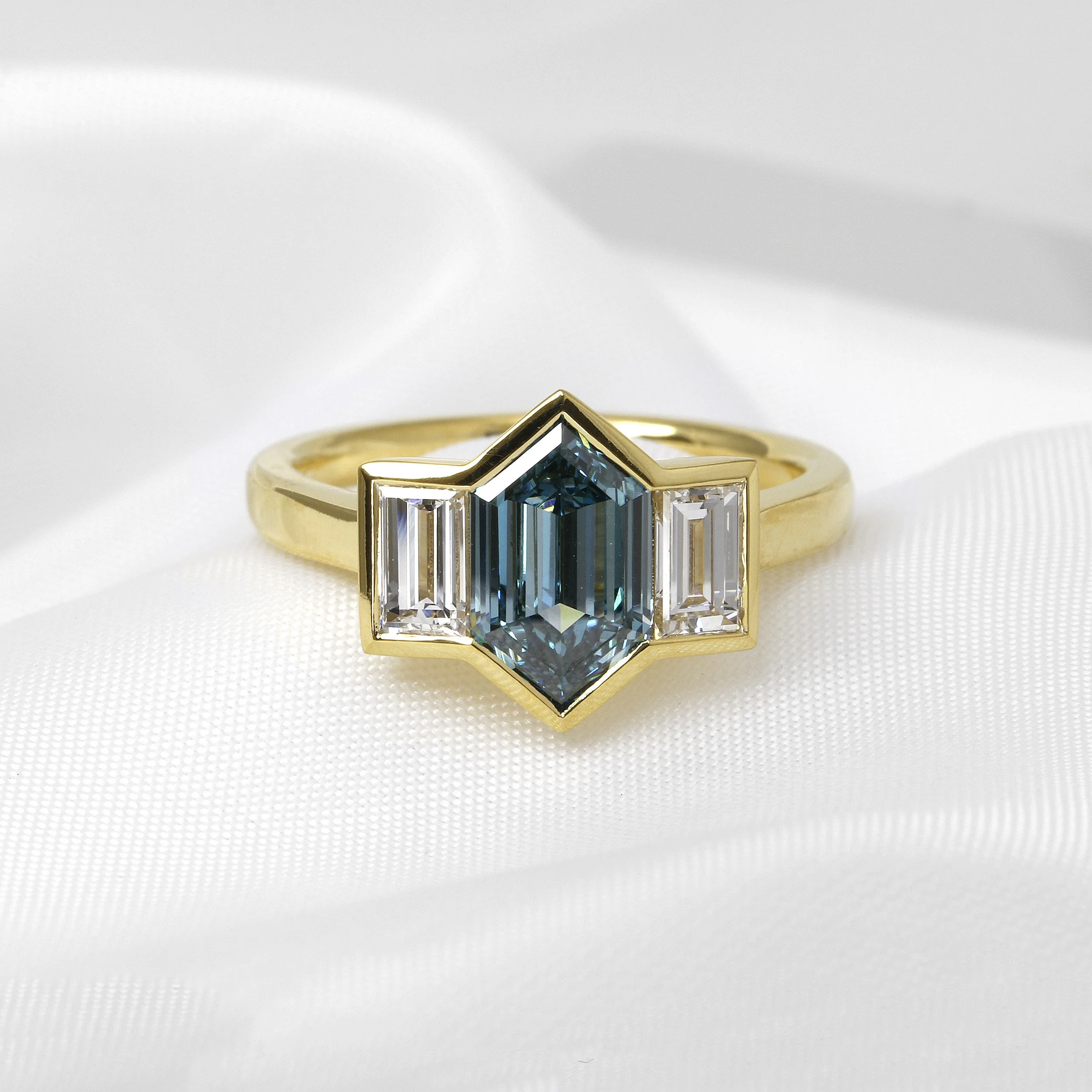 Laboratory Created Blue Diamond Three Stone Ring in Yellow Gold