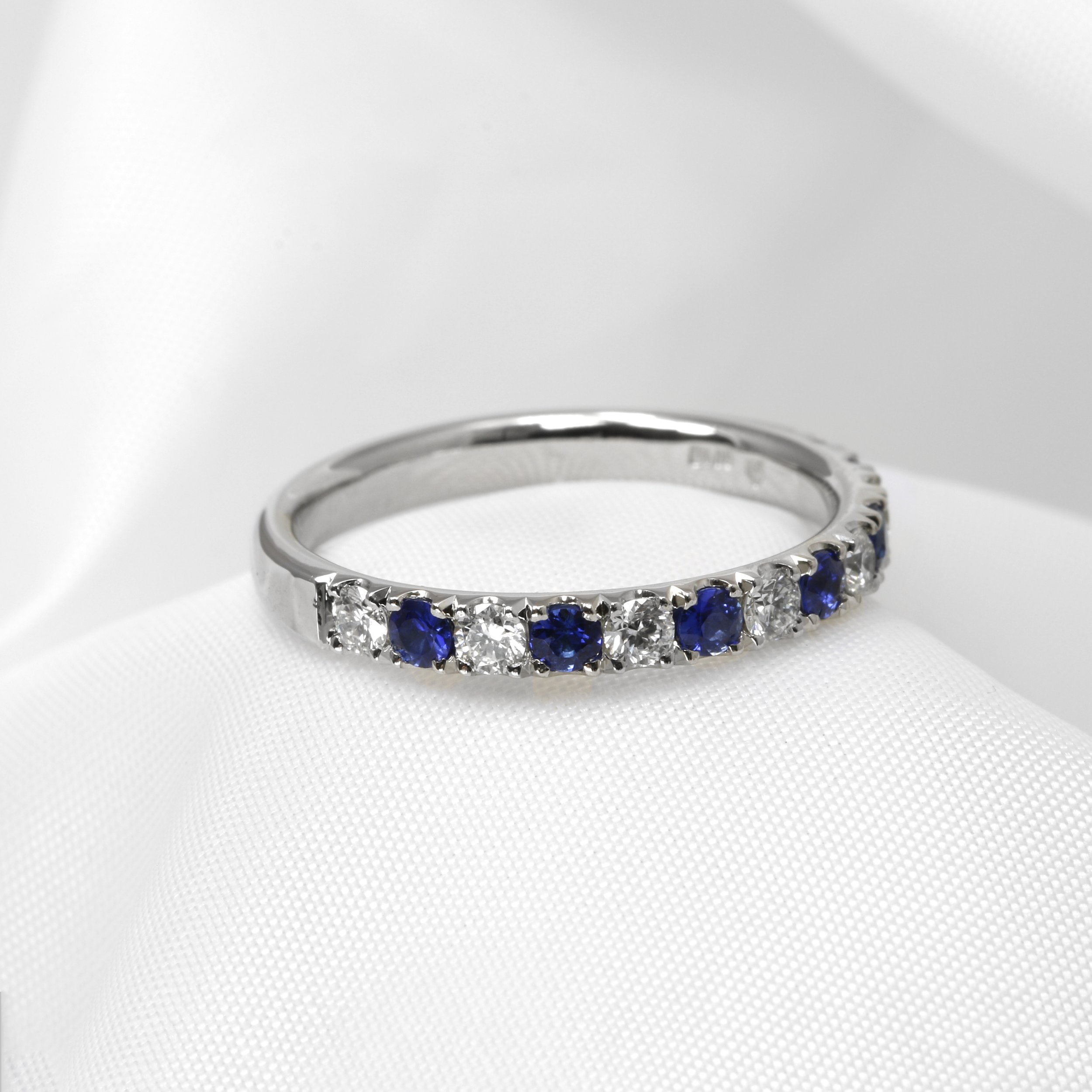 Sapphire and Diamond Half Eternity Ring in Platinum