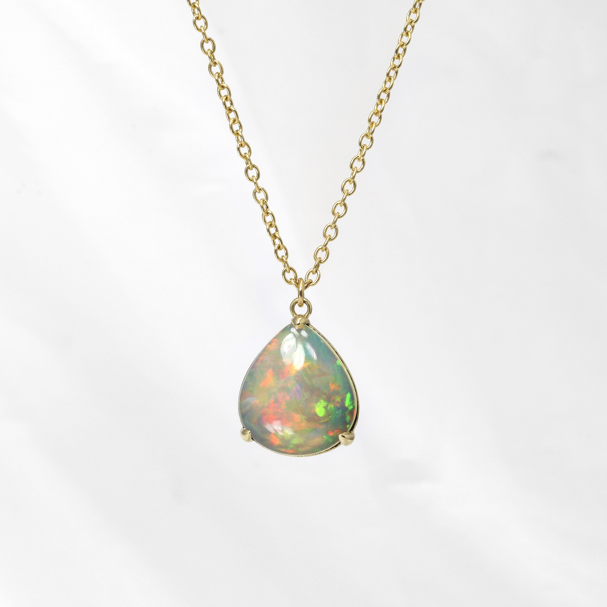 Pear Shape Opal Pendant in Yellow Gold