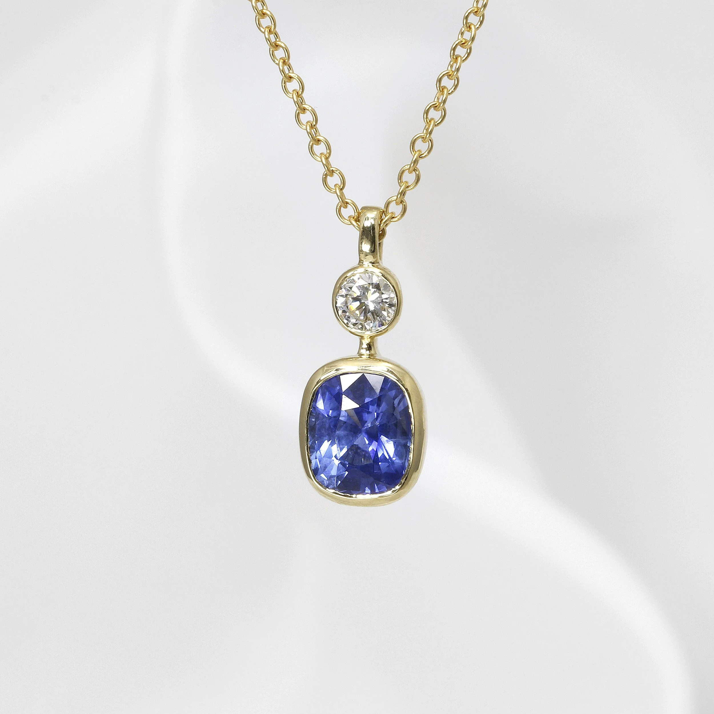 Cushion Shape Sapphire & Diamond Pendant in Yellow Gold