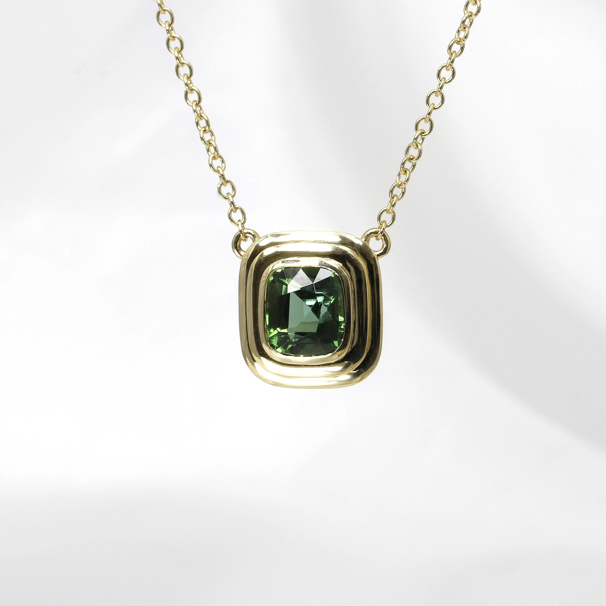 Green Tourmaline Pendant with a Feature Edge in Yellow Gold
